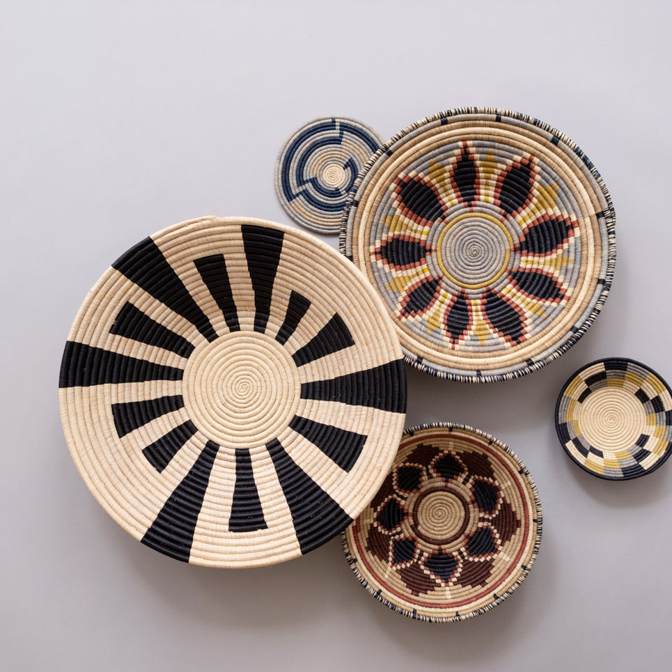 Set of woven baskets with various patterns on a light gray background
