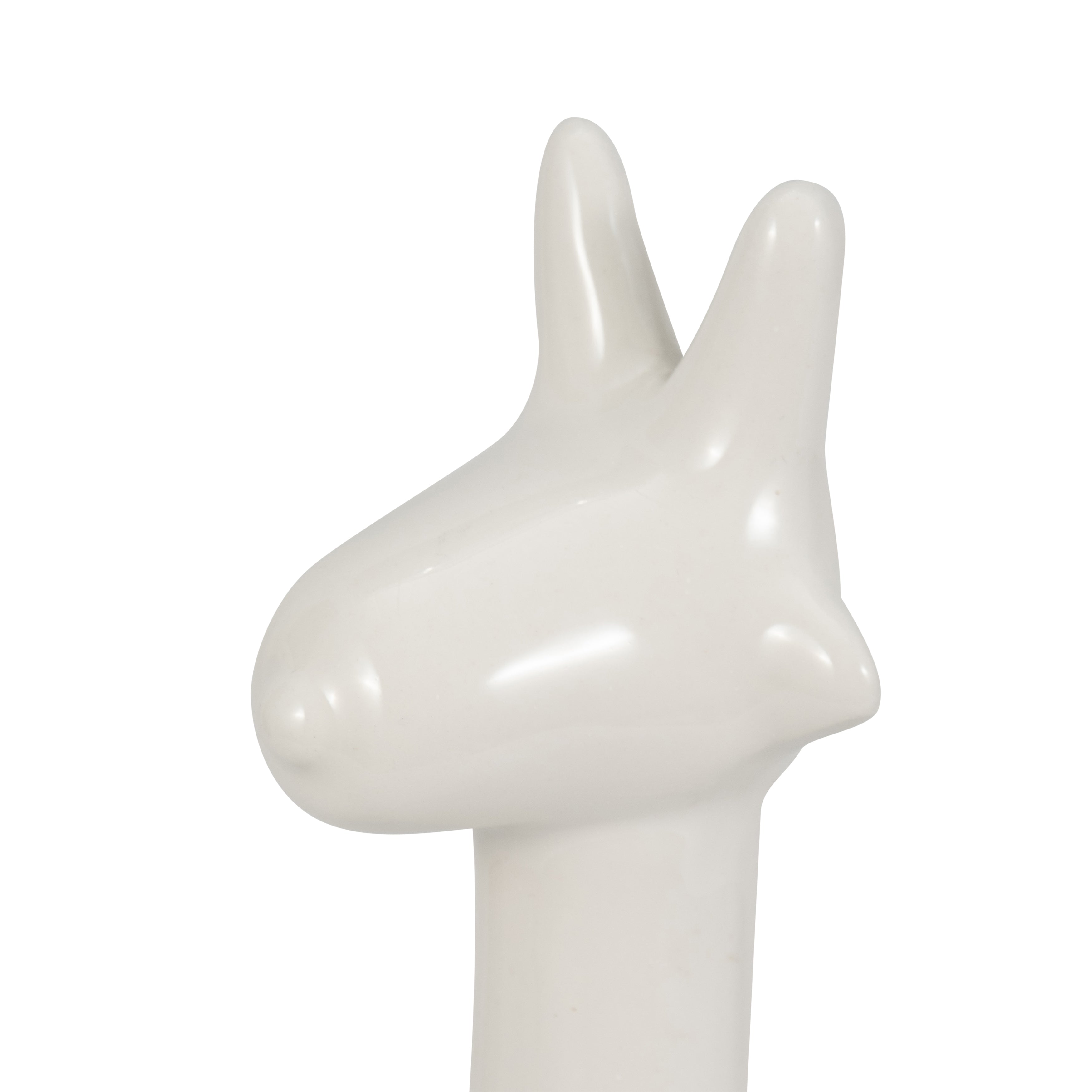 White ceramic sculpture of a donkey head on a white background