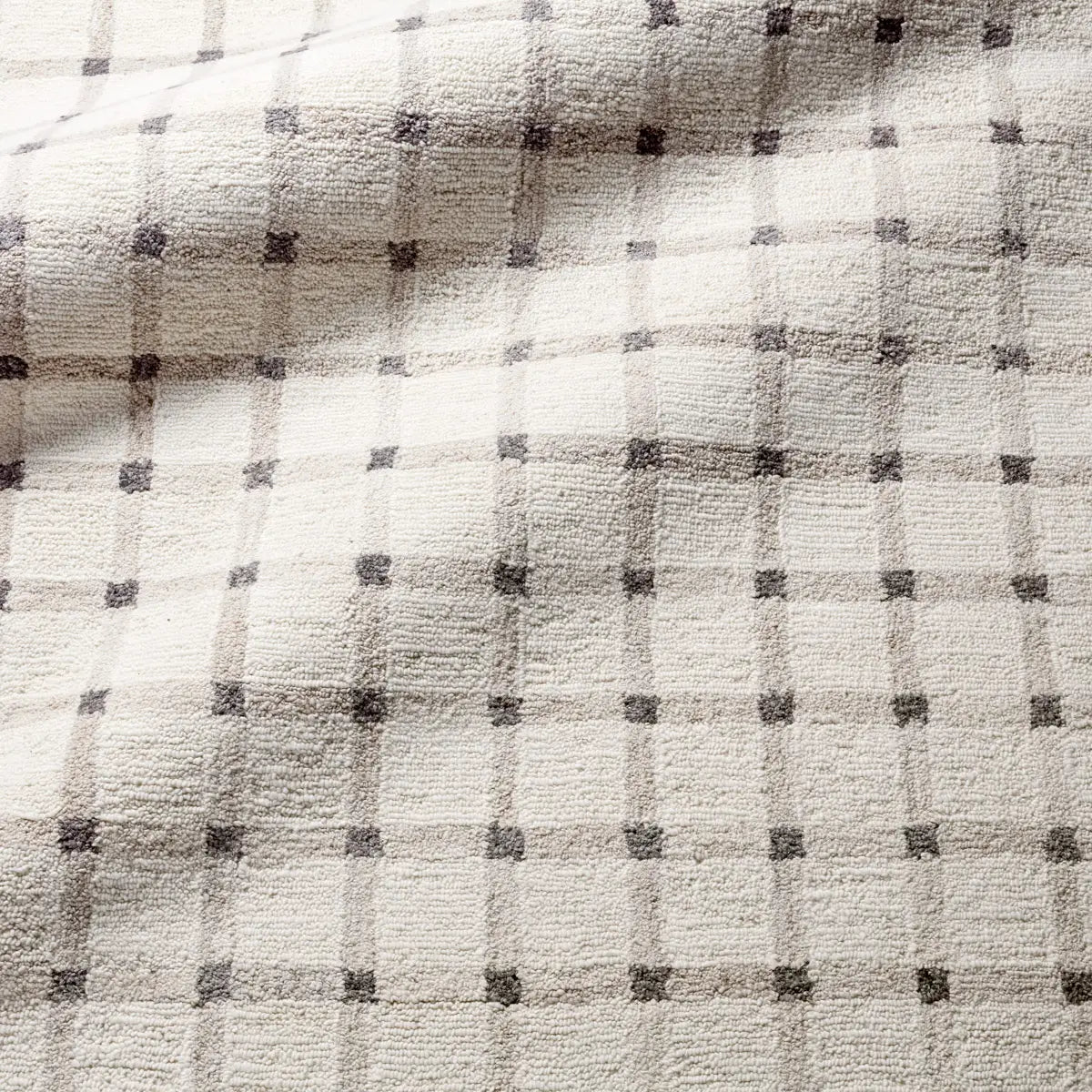 Close-up of a textured fabric with a checkered pattern
