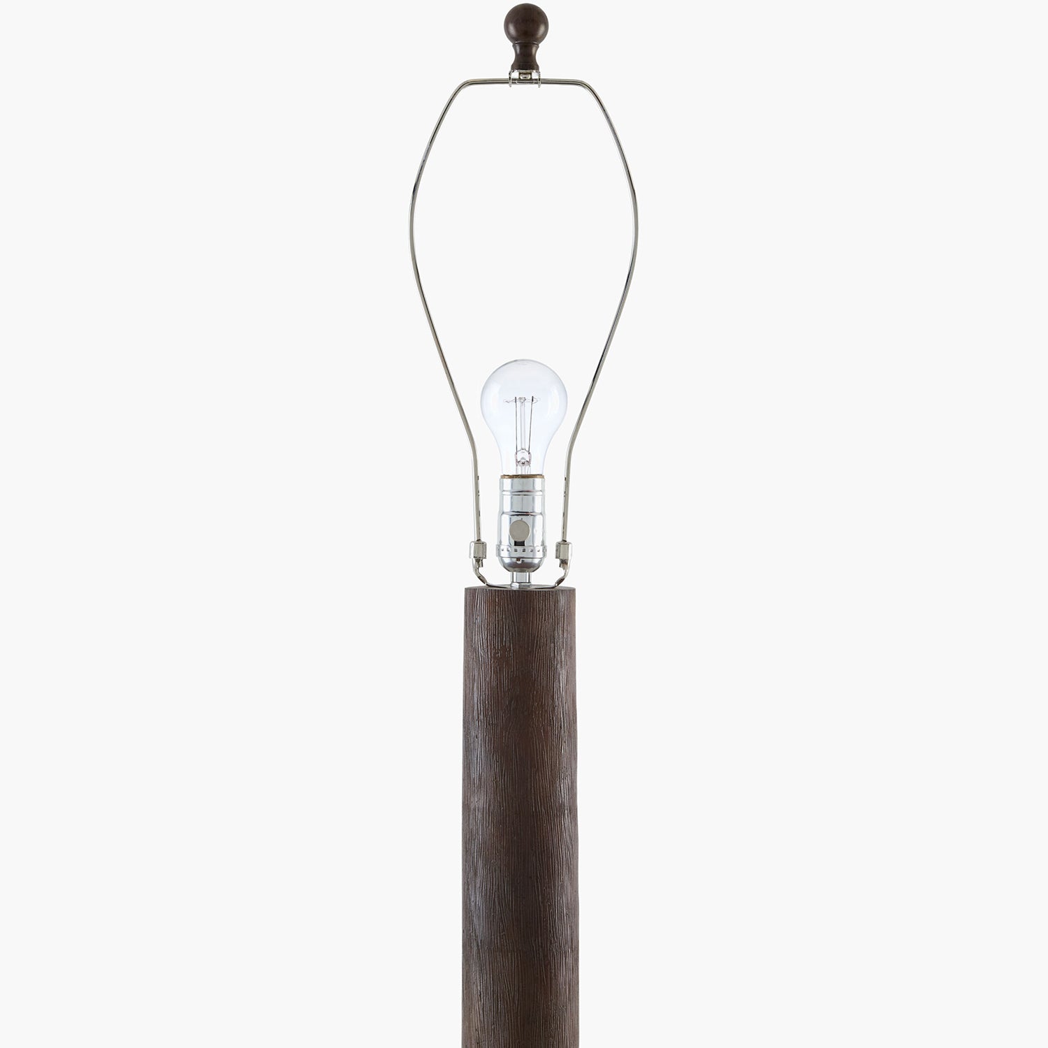Clear light bulb with wooden base on a white background