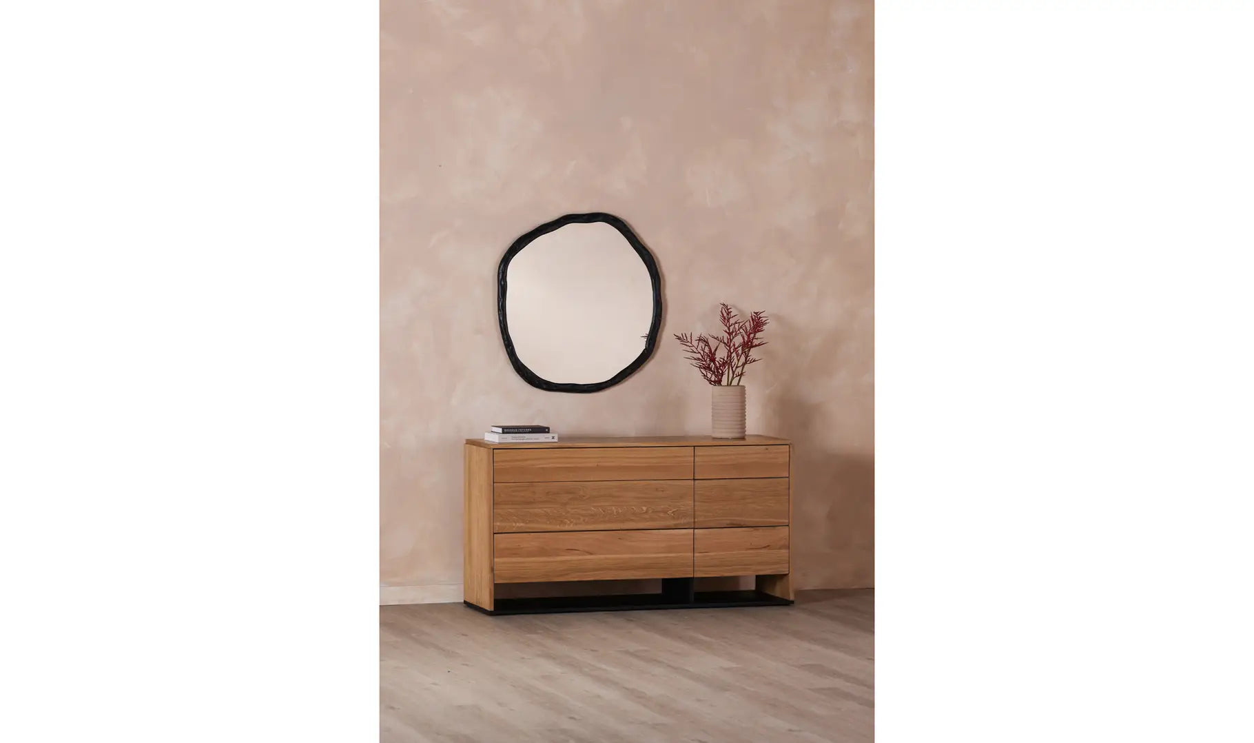 Round mirror with a black frame on a white background