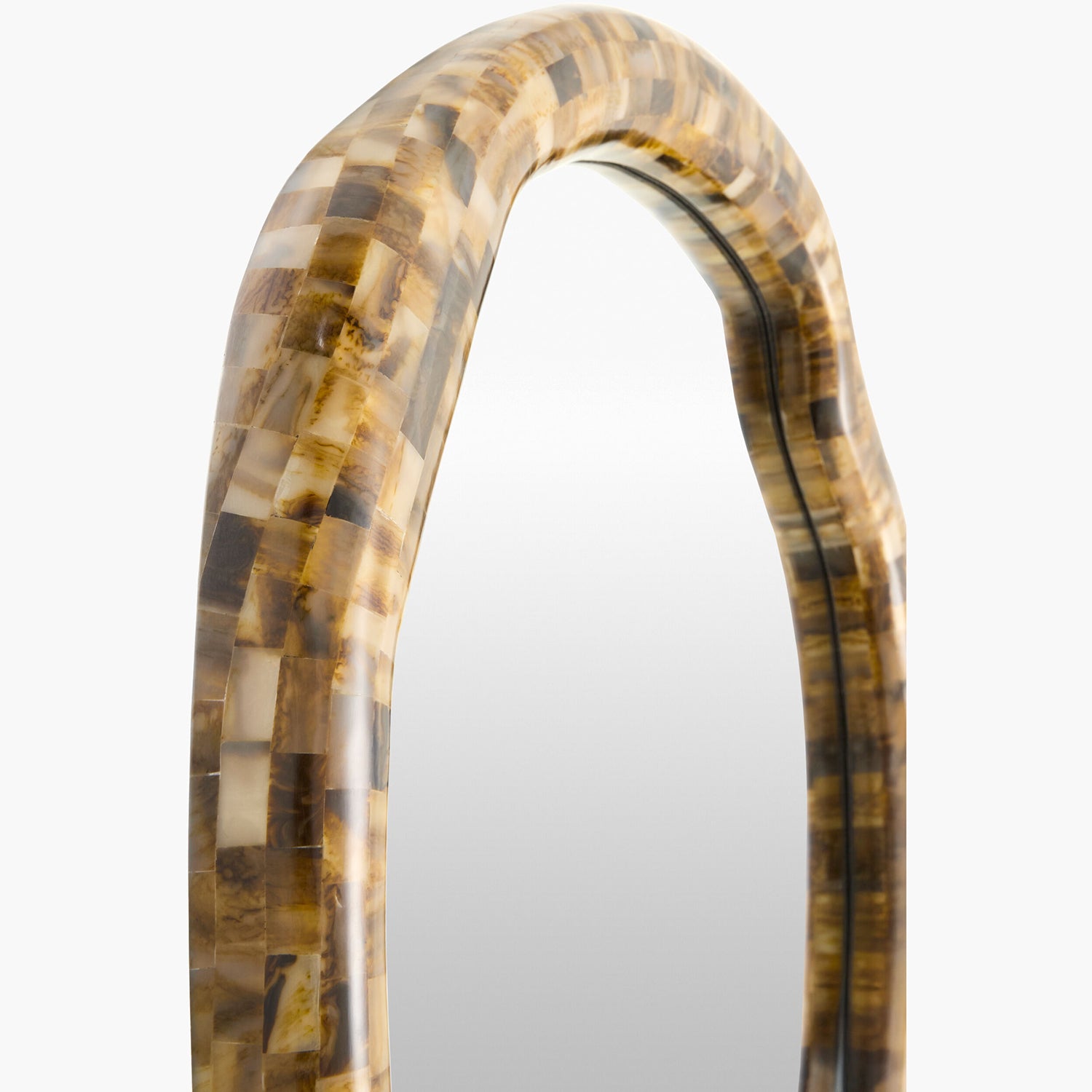 Decorative mirror with a tortoiseshell-like frame on a white background