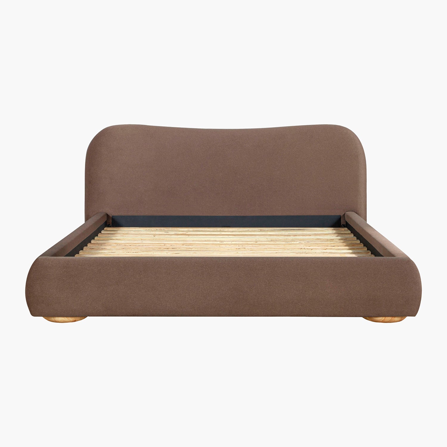 Brown upholstered bed on a white background