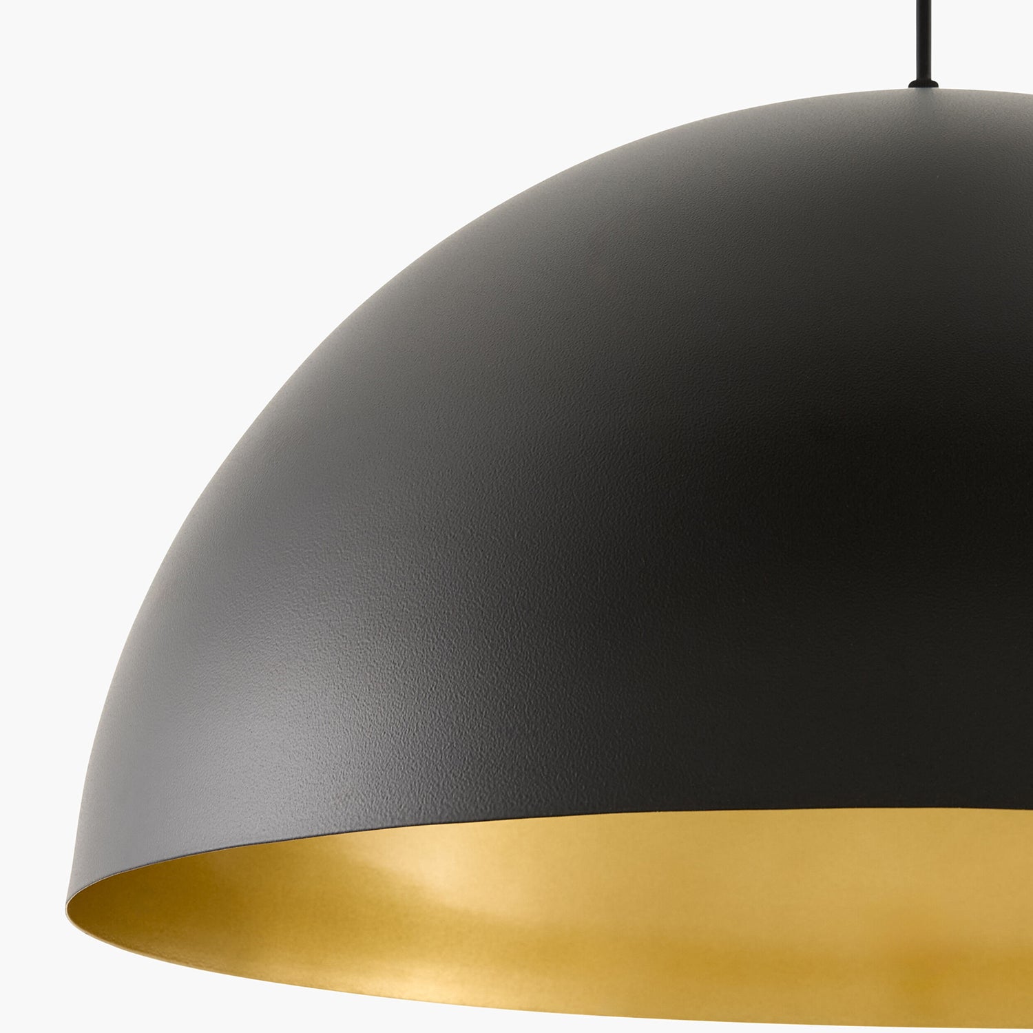 Black pendant light with gold interior on a white background