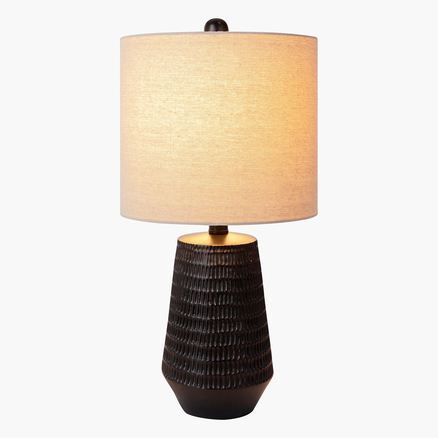 Table lamp with textured brown base and beige lampshade on a white background