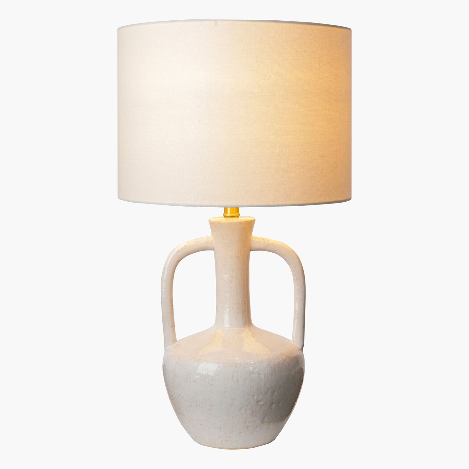 White ceramic lamp with a beige lampshade on a white background