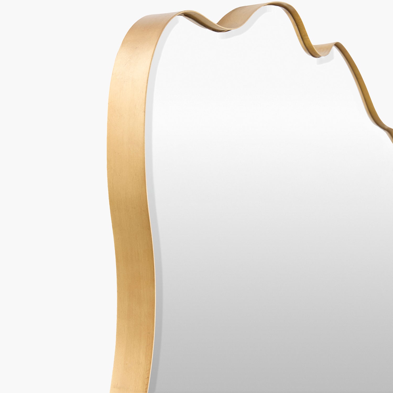 White mirror with a gold frame on a white background