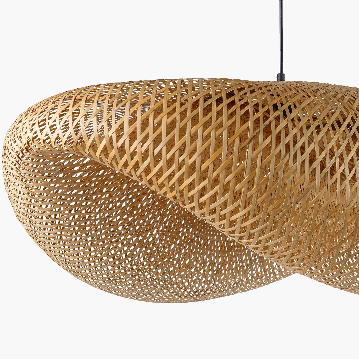 Woven rattan pendant light on a white background