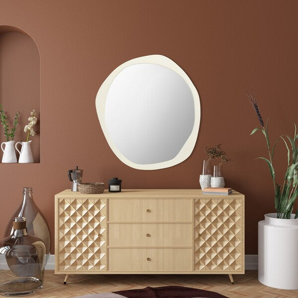 Wooden dresser with round mirror on a brown wall