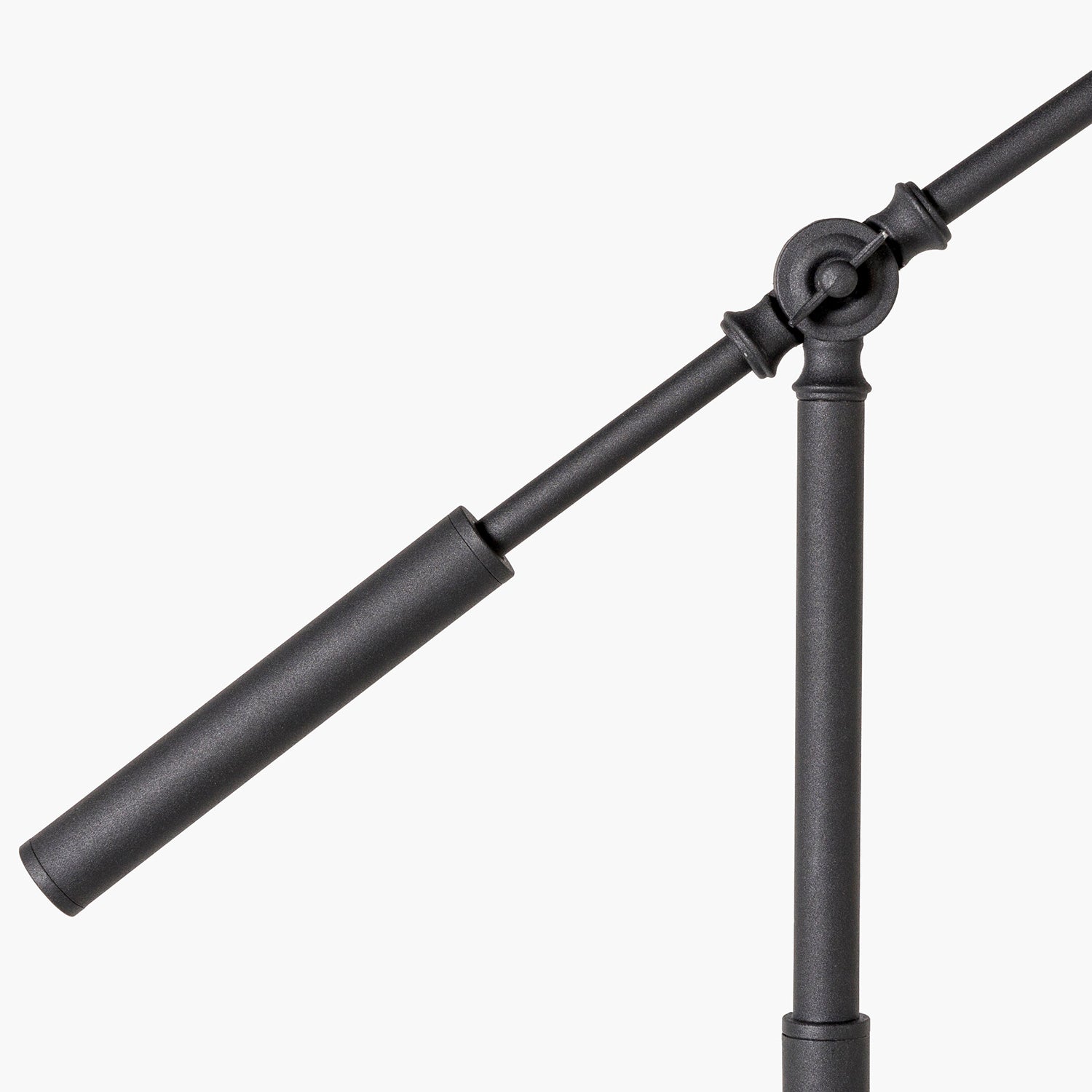 Black metal microphone stand on a white background