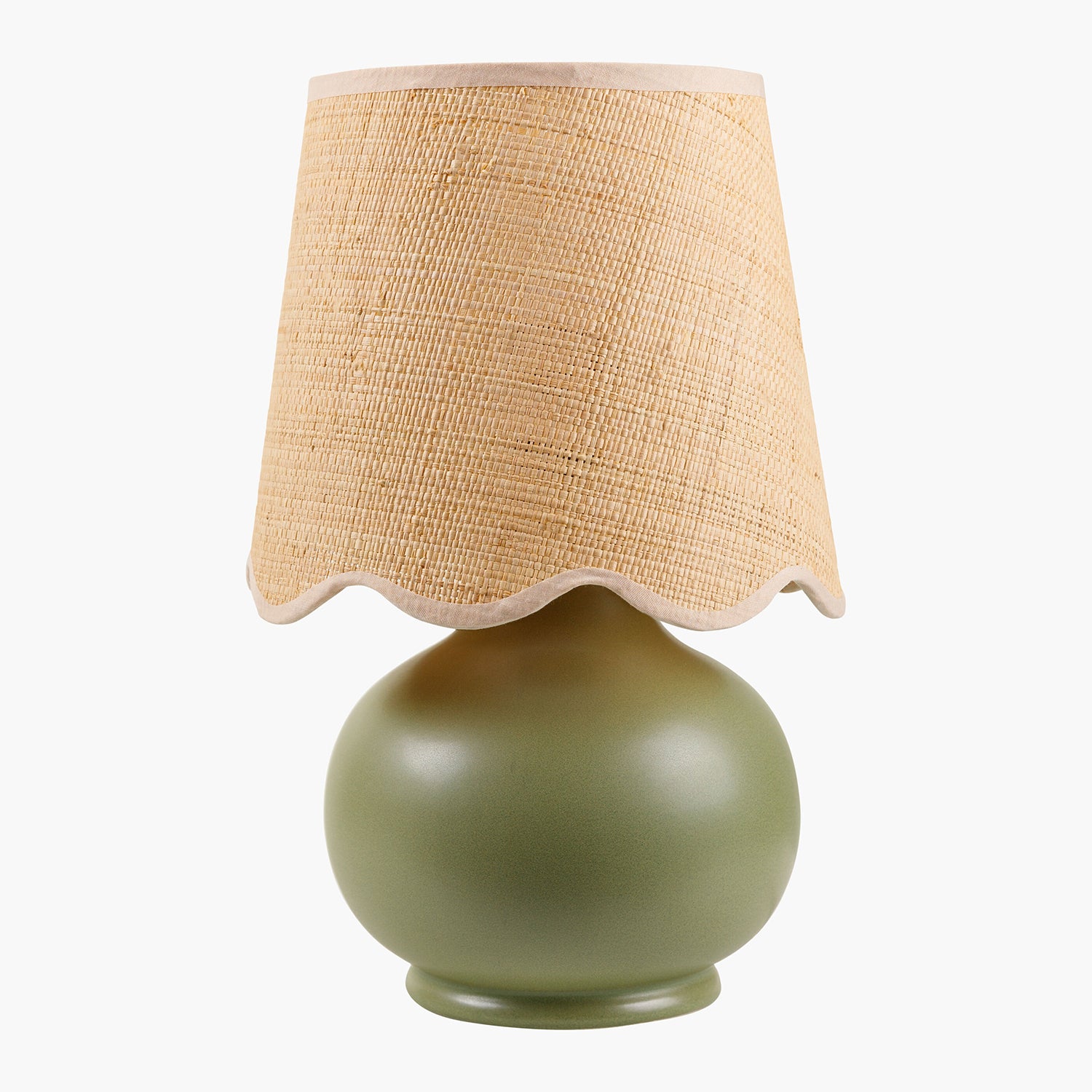 Table lamp with a green base and beige woven shade on a white background