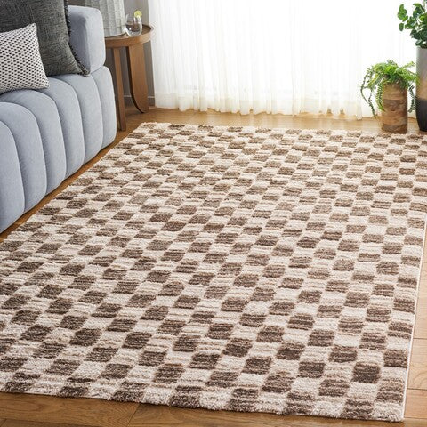 A shaggy area rug with a geometric pattern in ivory and brown tones.