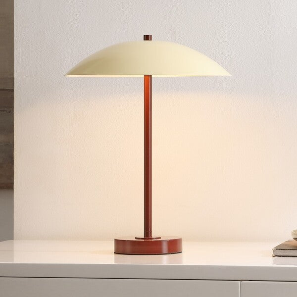 Table lamp with beige shade and brown base on a light surface.
