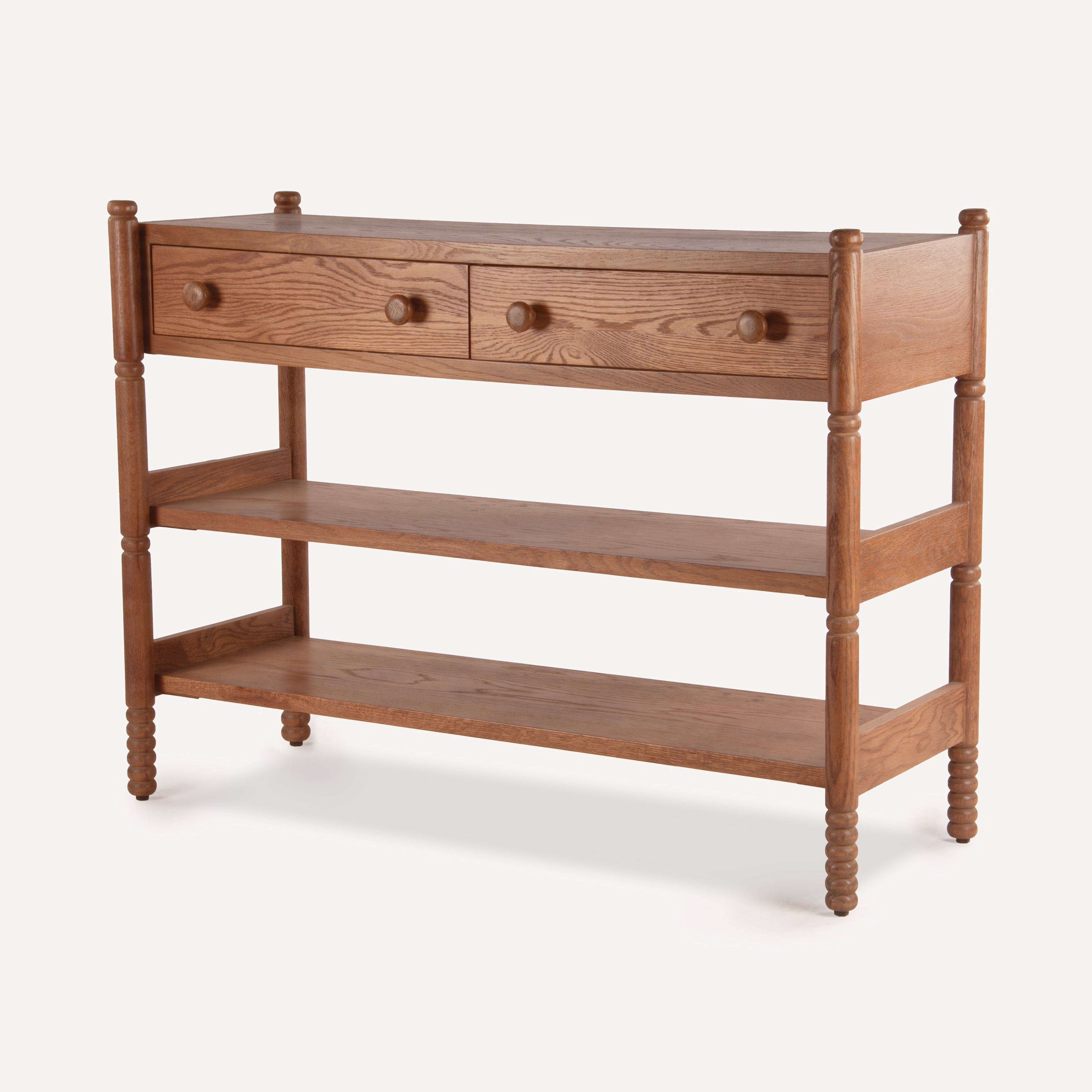 A mid-century modern wooden console table with two drawers, a central open shelf, and two lower open shelves, finished in a warm medium brown wood tone with round knobs.