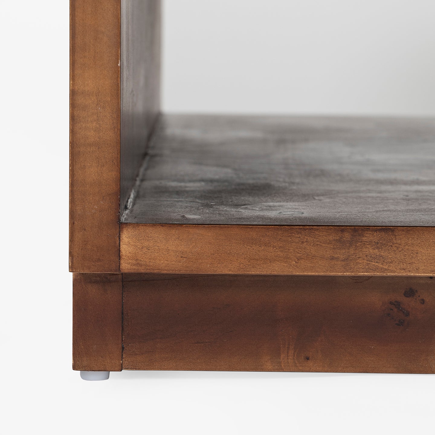 Close-up of a wooden coffee table with a shelf on a white background