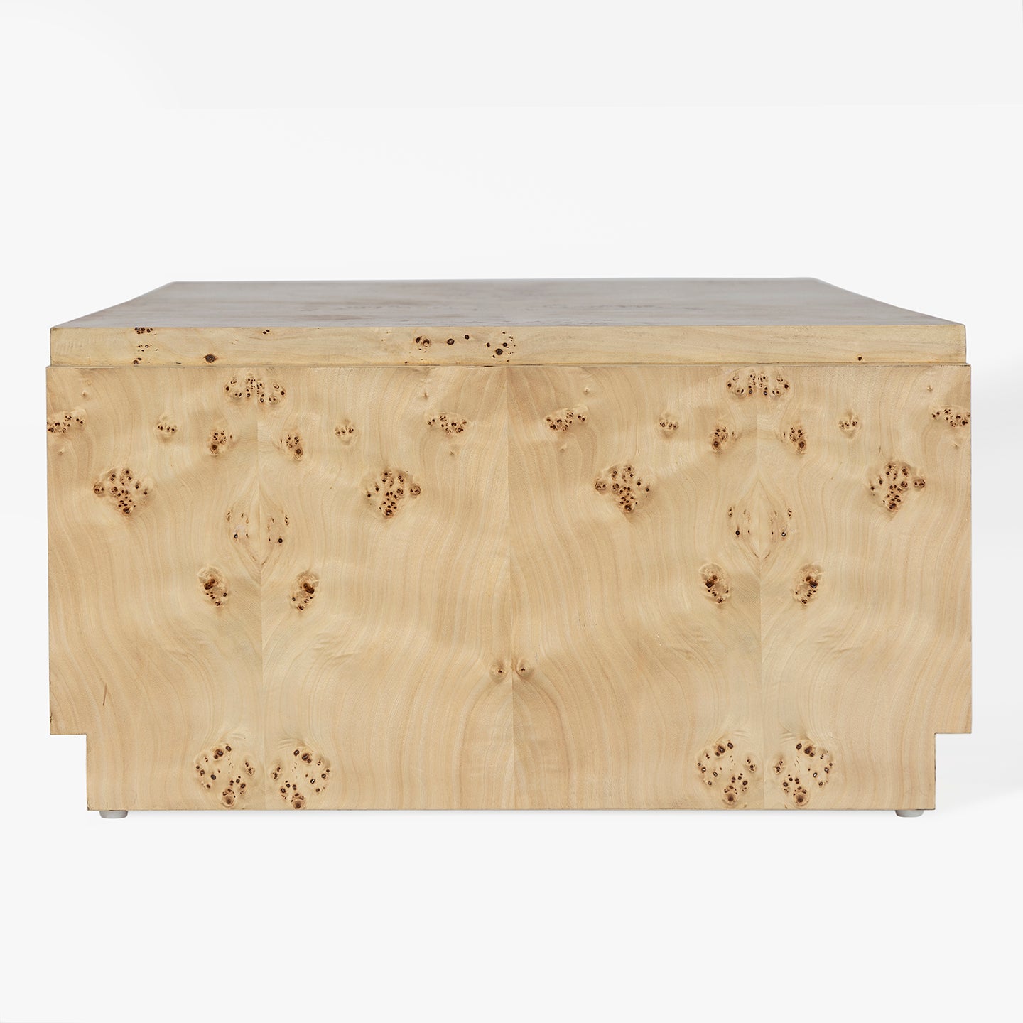 Side view of a wooden coffee table in a light burl focus 