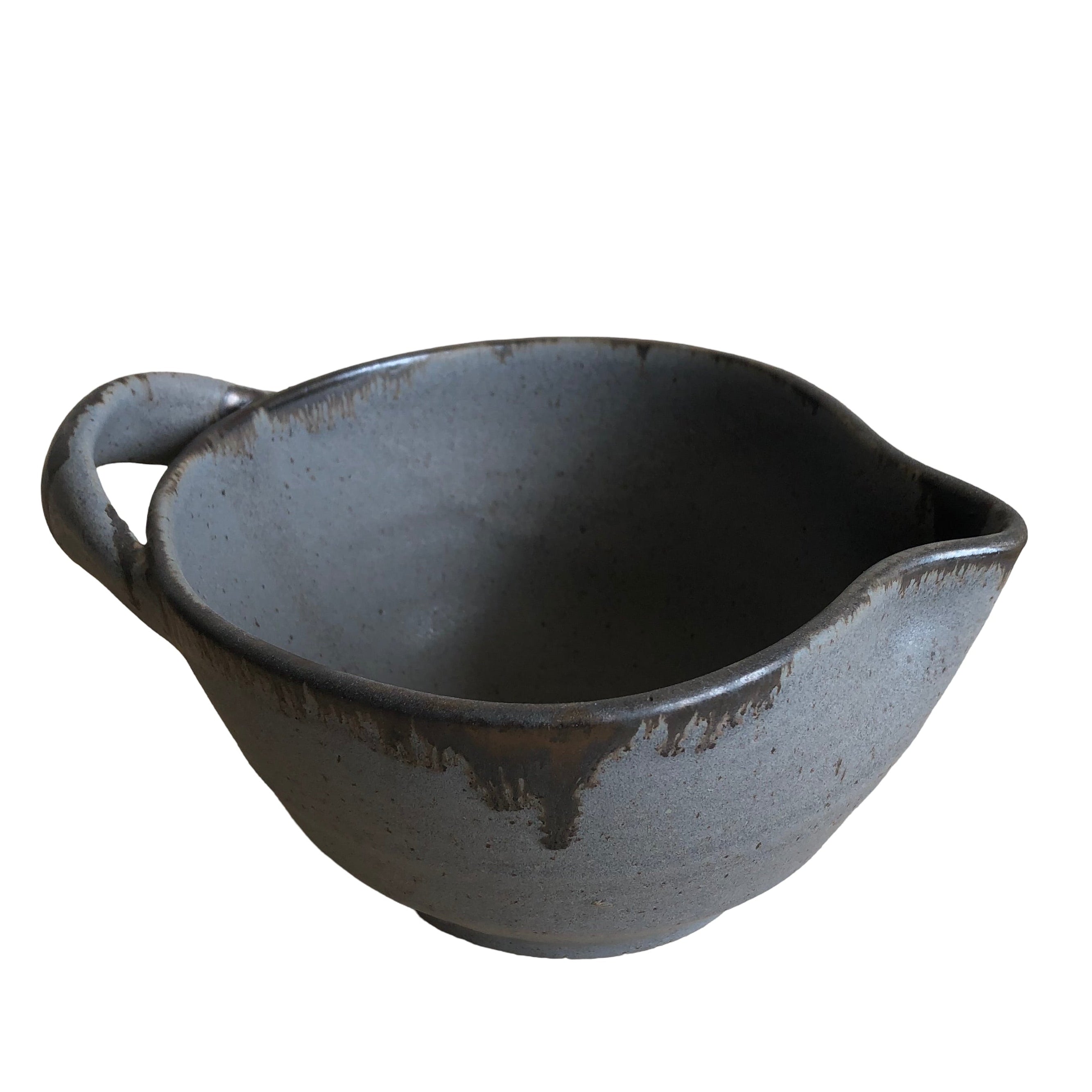 Gray ceramic bowl with handle on a white background