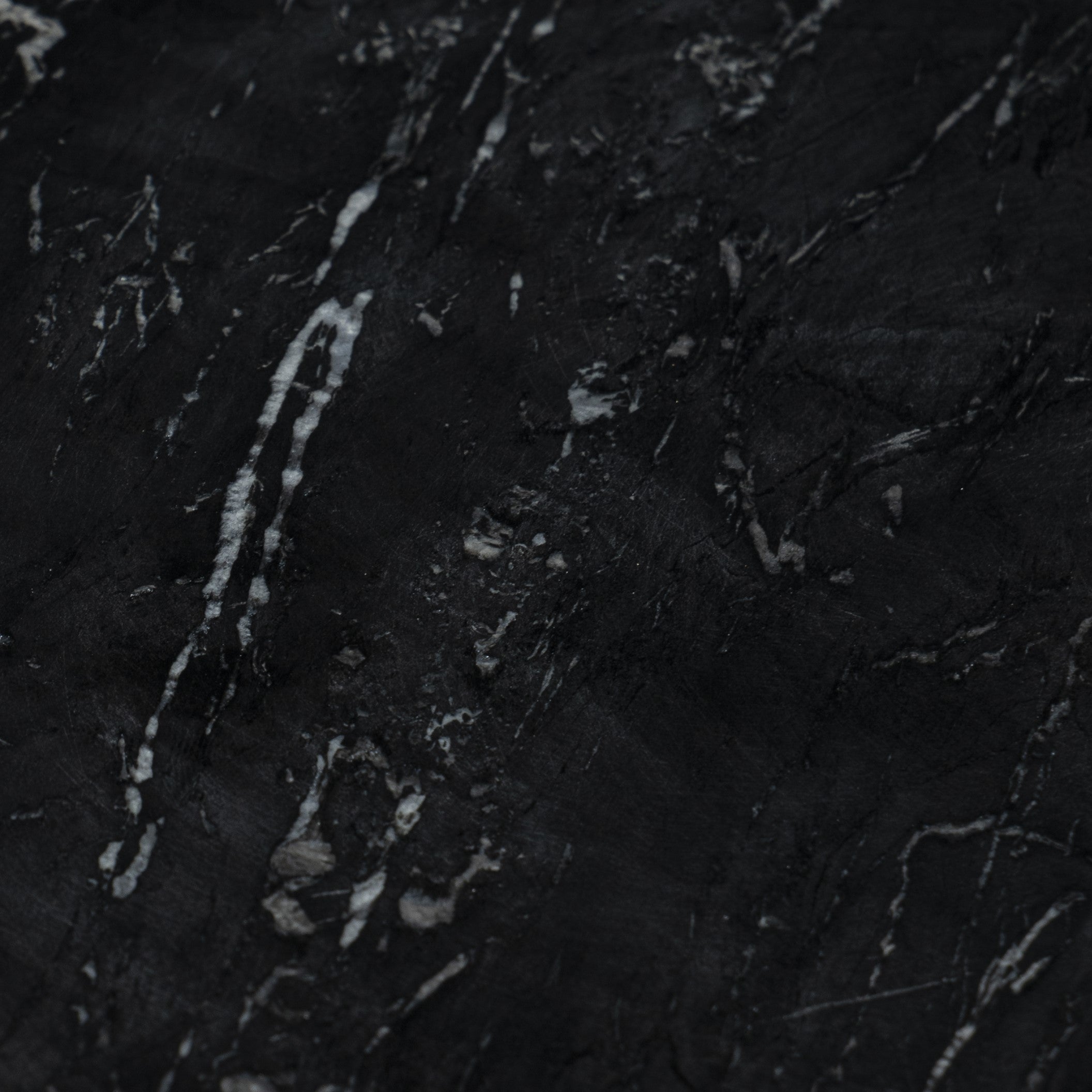 Close-up of a black marble table top