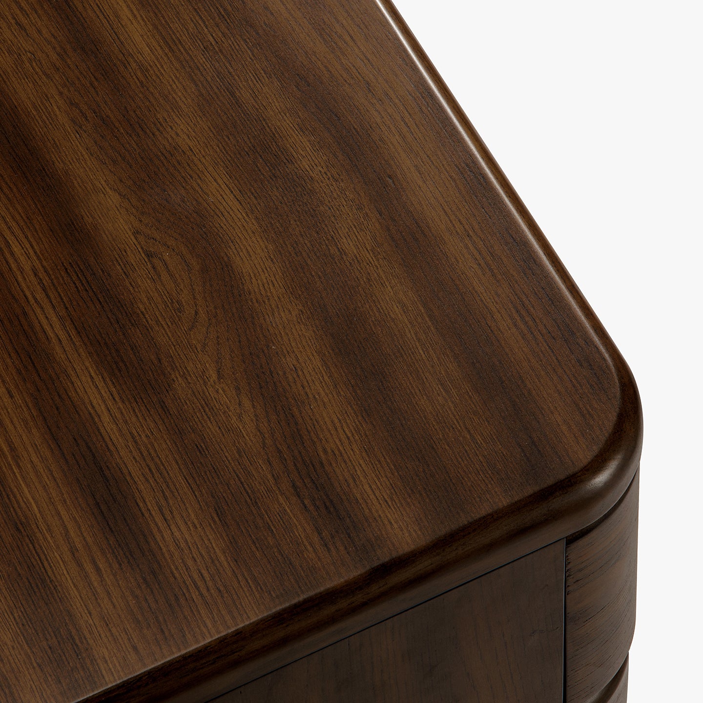 Close-up of a wooden nightstand tabletop with a smooth finish