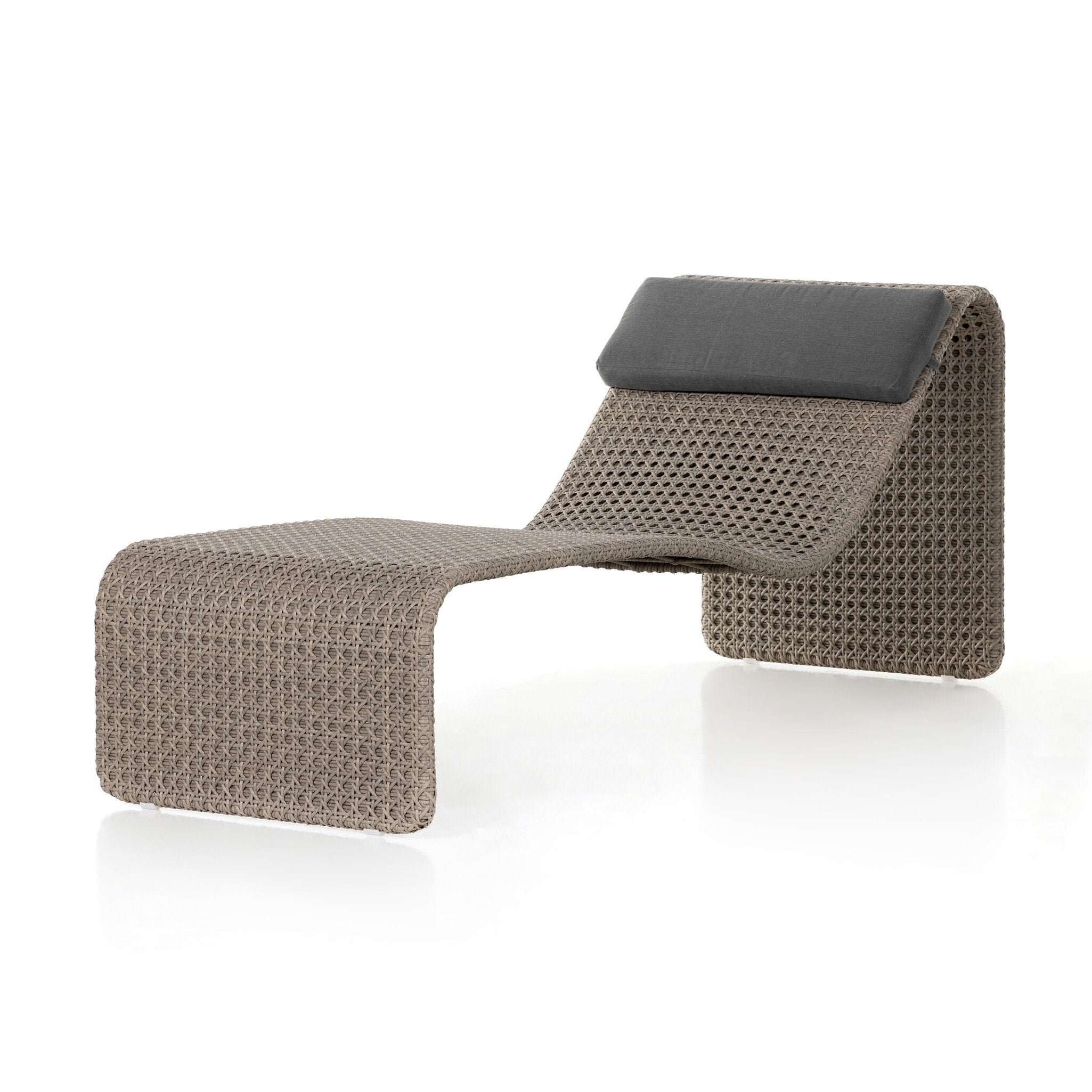 Modern lounge chair with woven design and black cushion on a white background