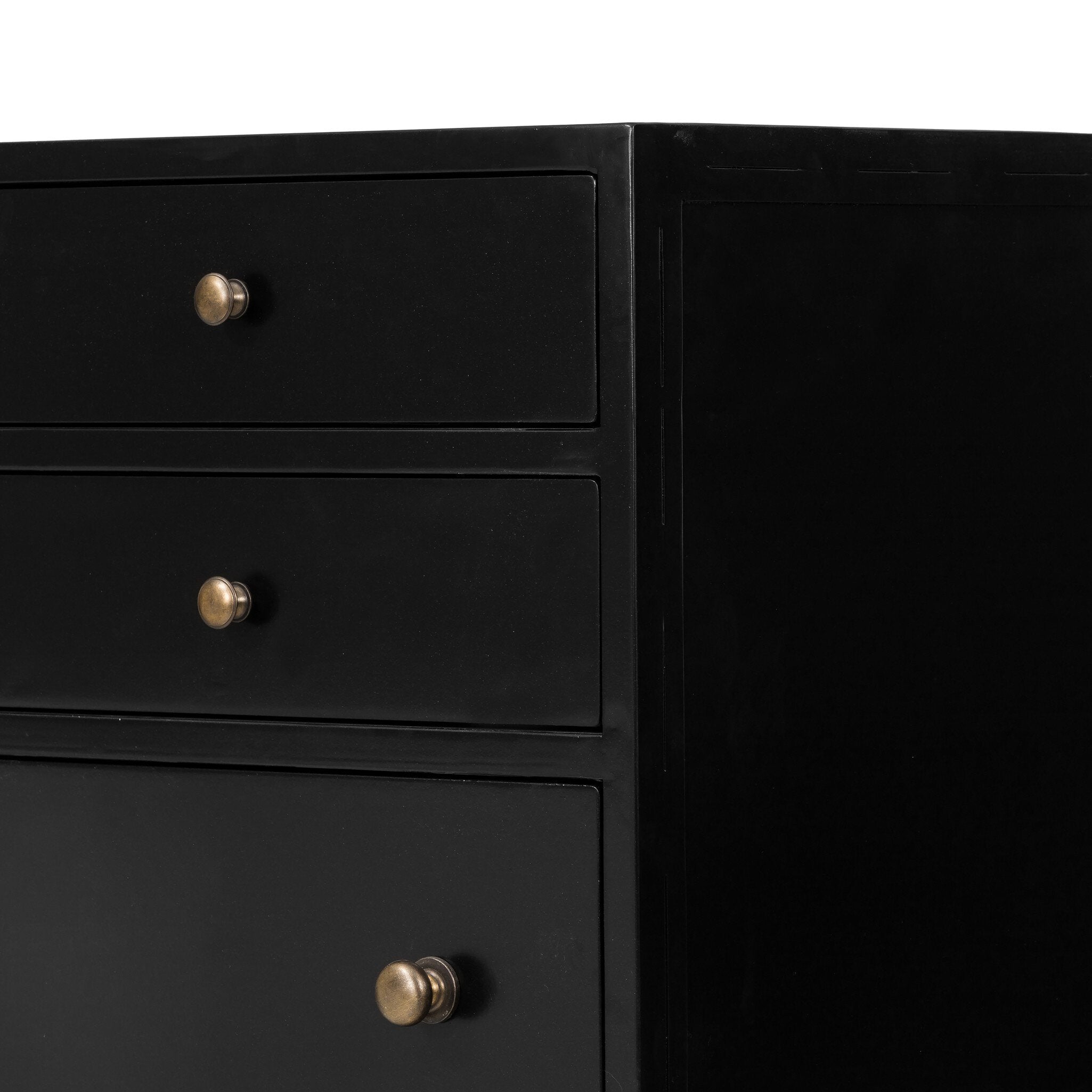Black dresser with gold knobs on a white background