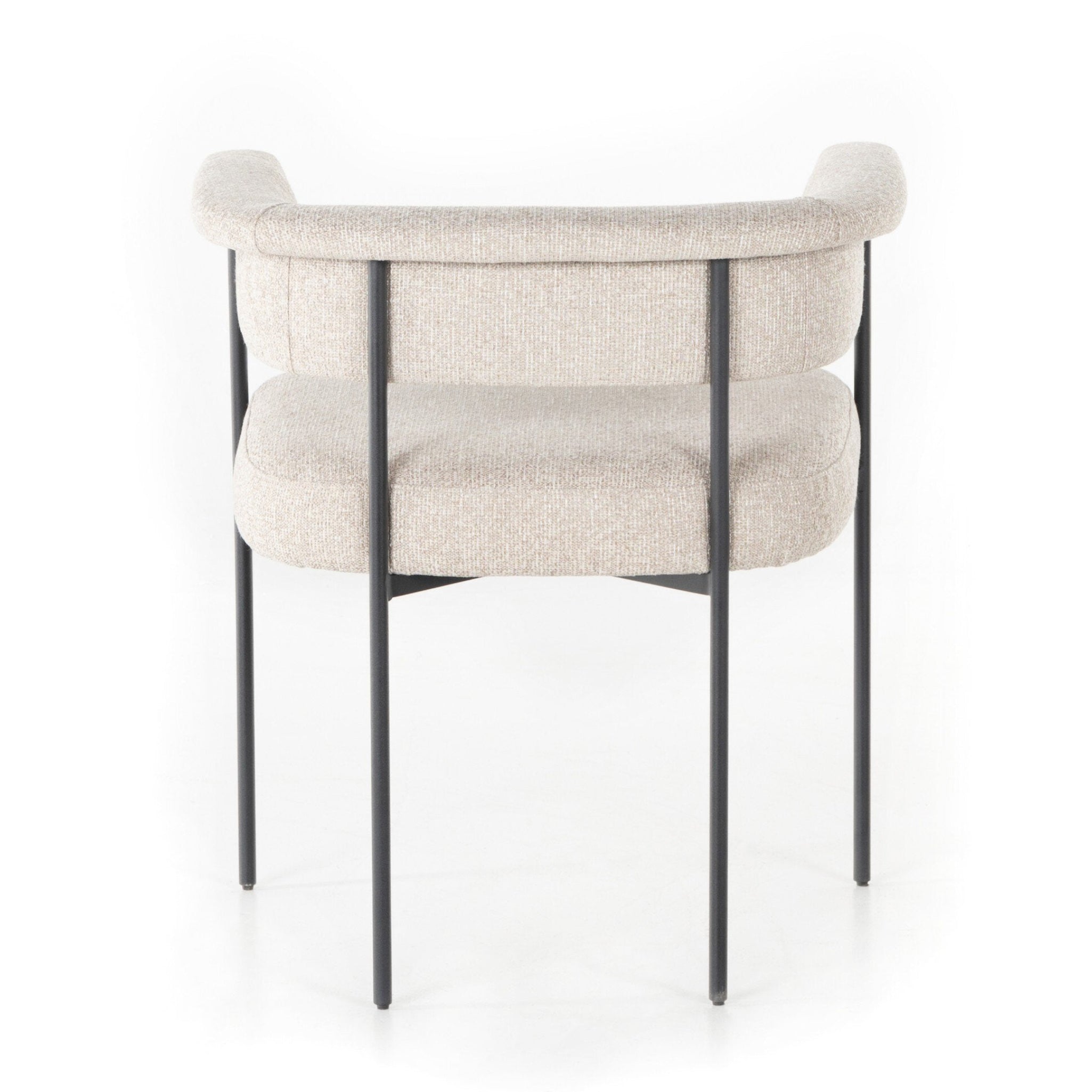 Beige armchair with black metal legs on a white background