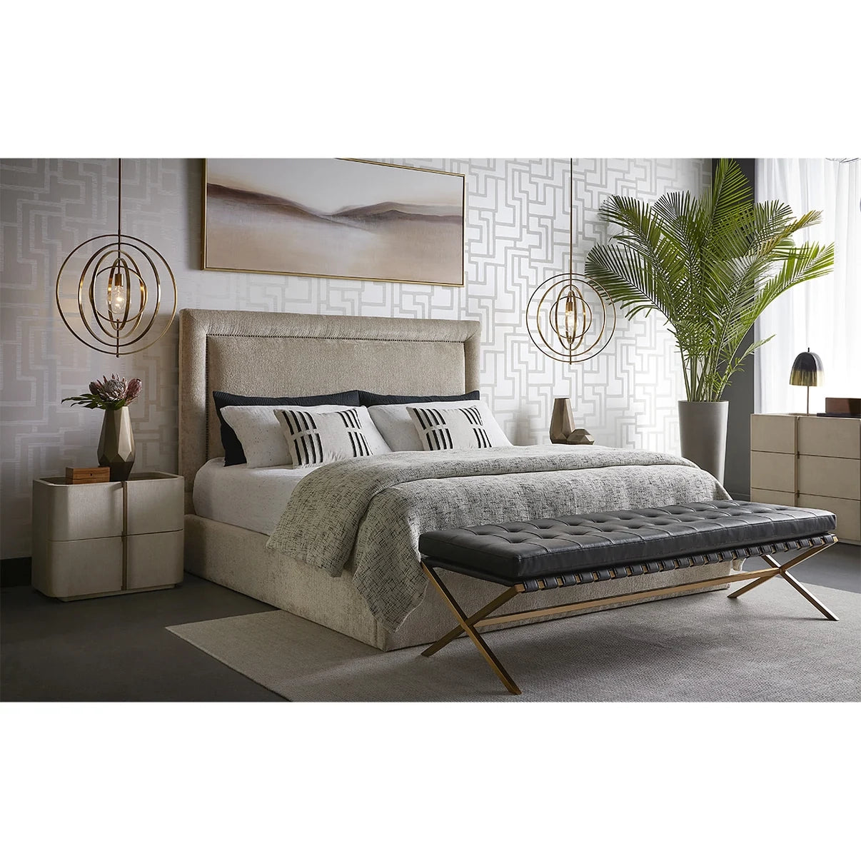 Modern bedroom with a bed, bench, and decorative elements.