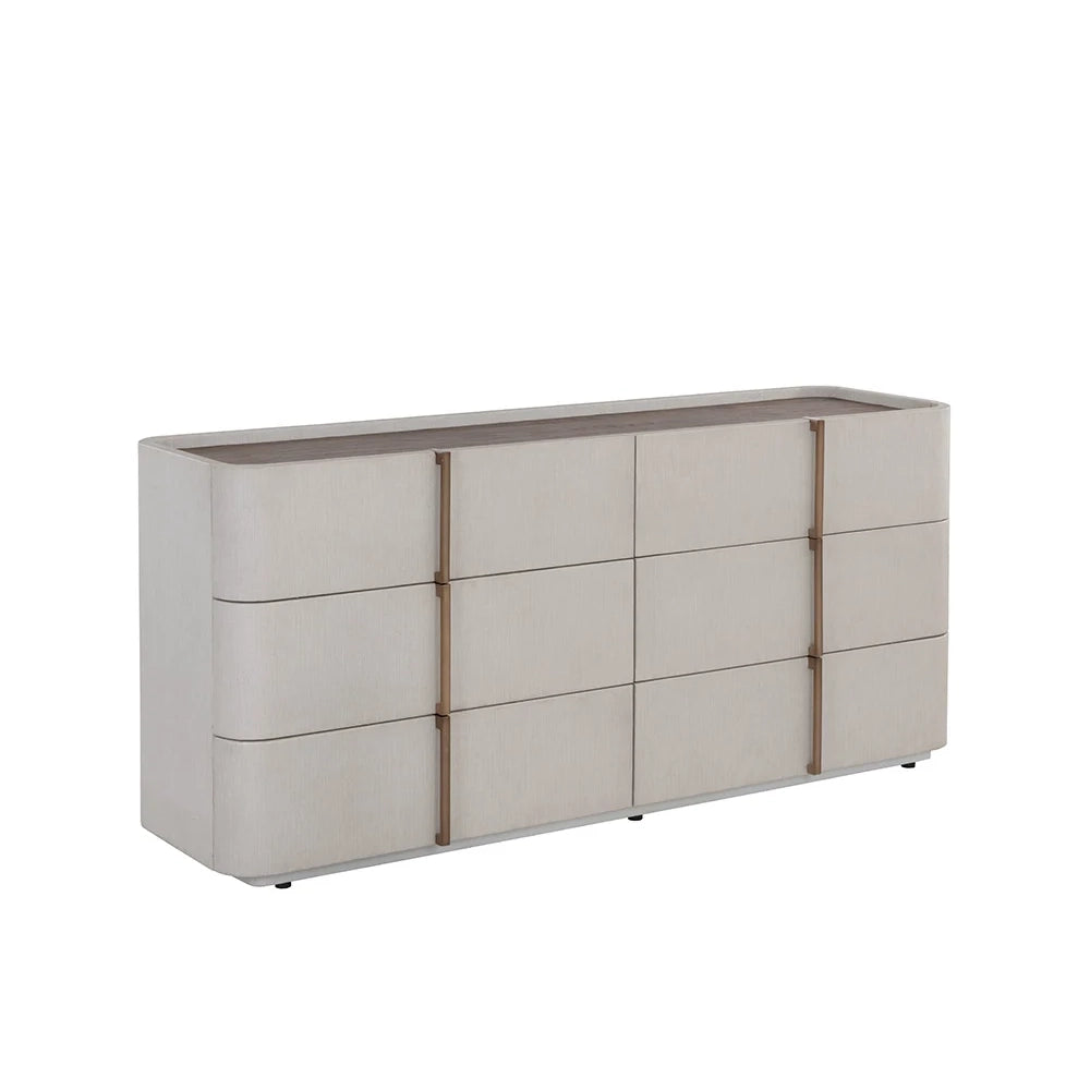 A modern 6-drawer dresser with a light beige textured finish, featuring vertical bronze metal handles and a dark brown top surface, shown on a plain white background.