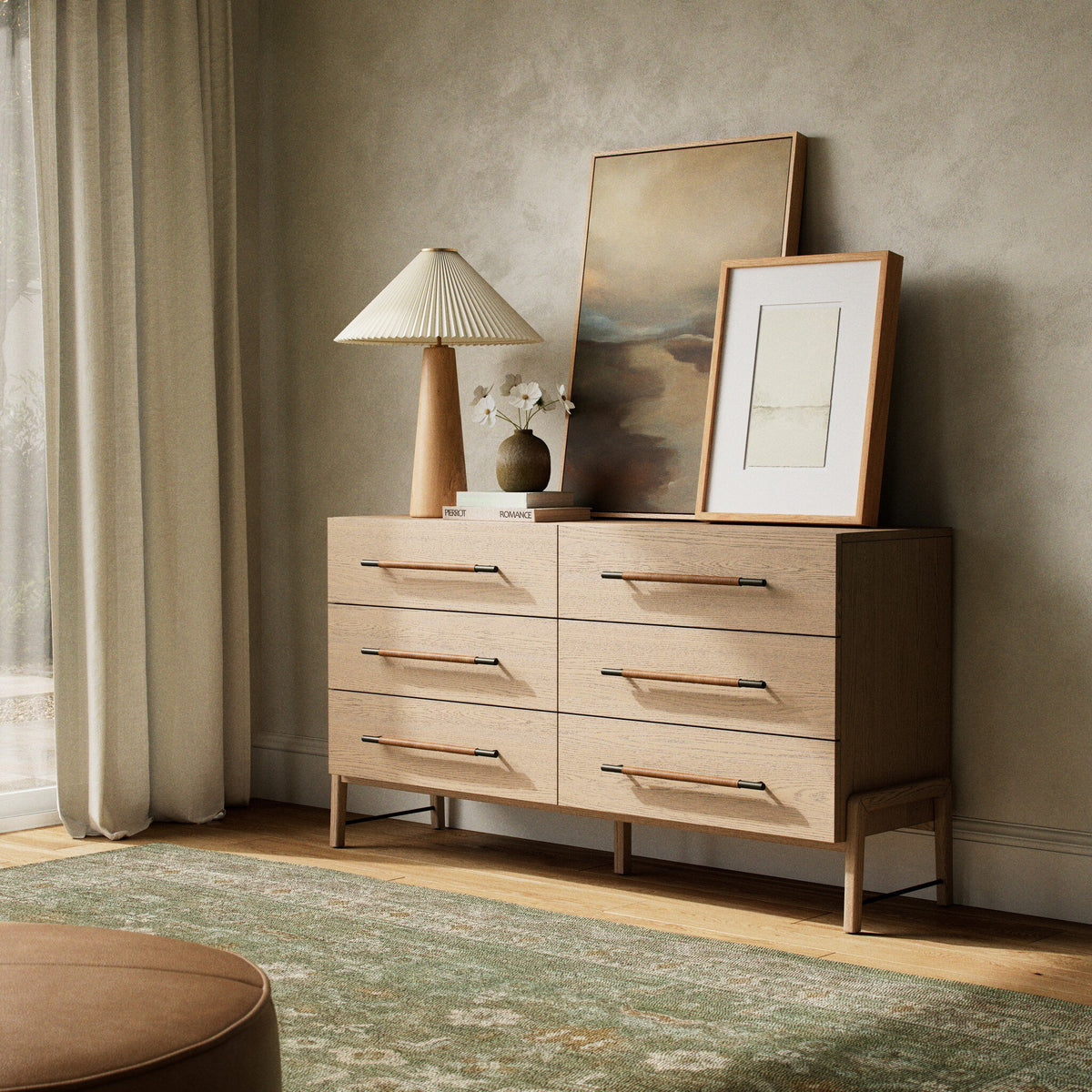 Wooden dresser with decorative items in a room with curtains and a rug.