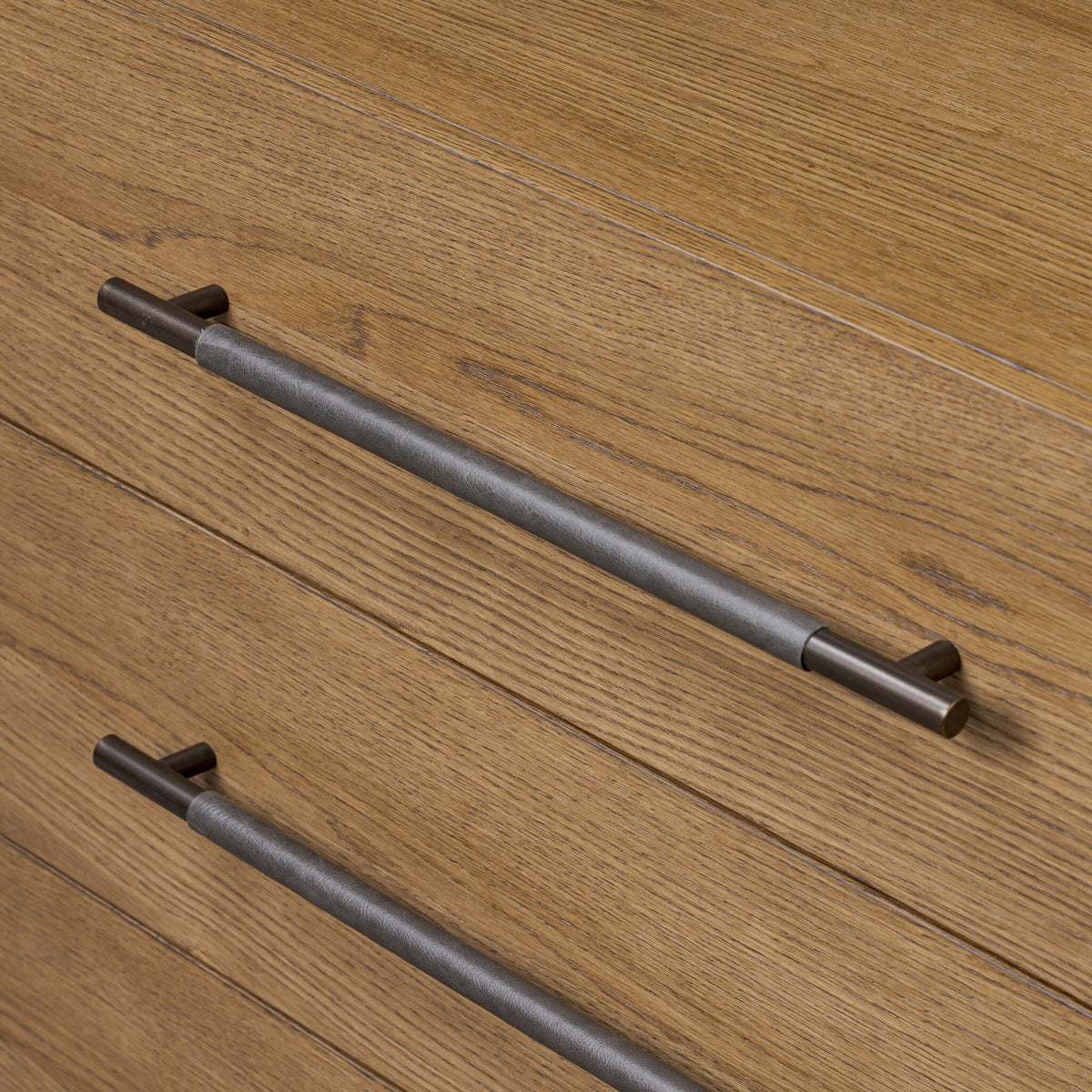 Metal handles on a wooden cabinet