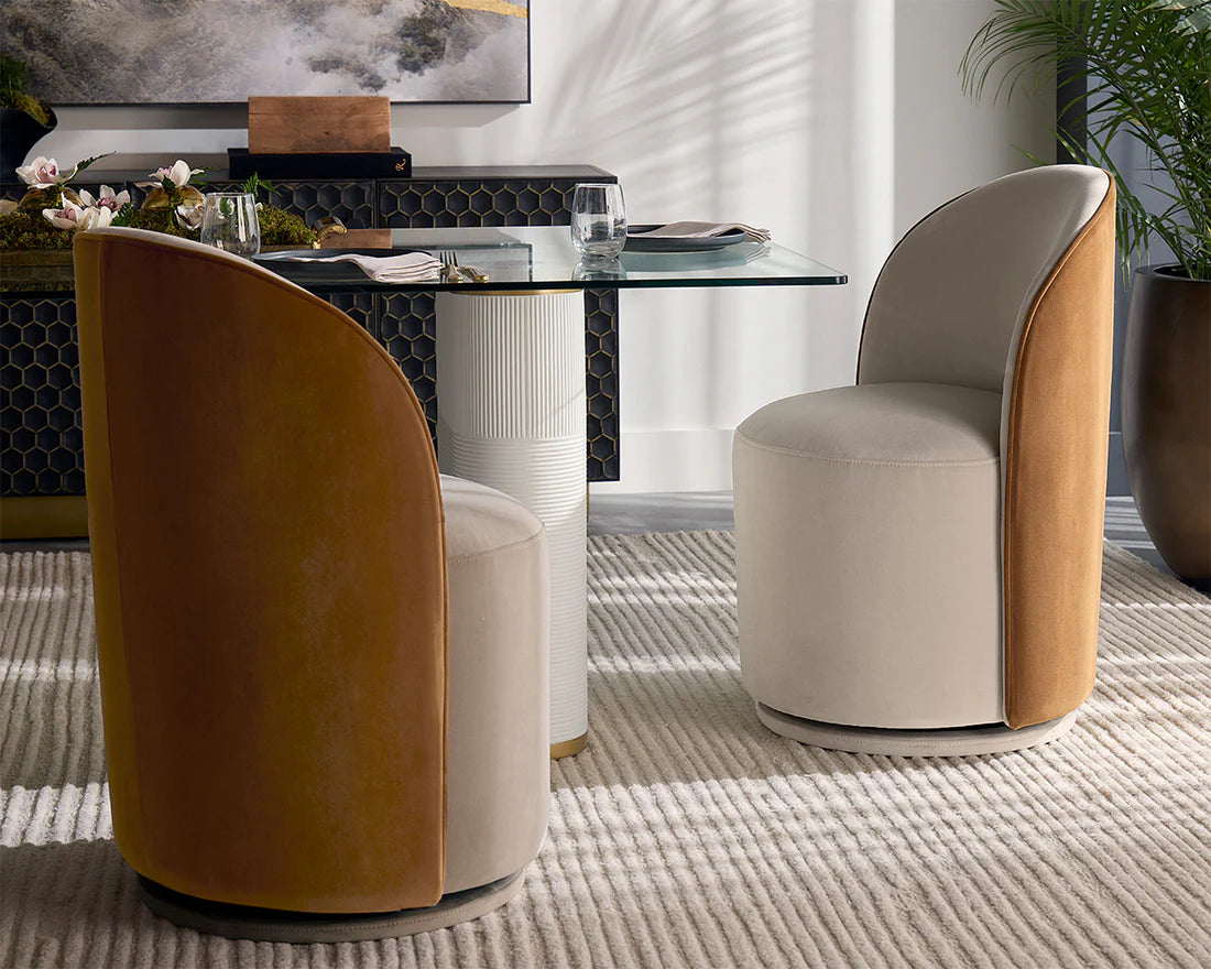 Modern chairs with a glass dining table in a stylish interior setting.