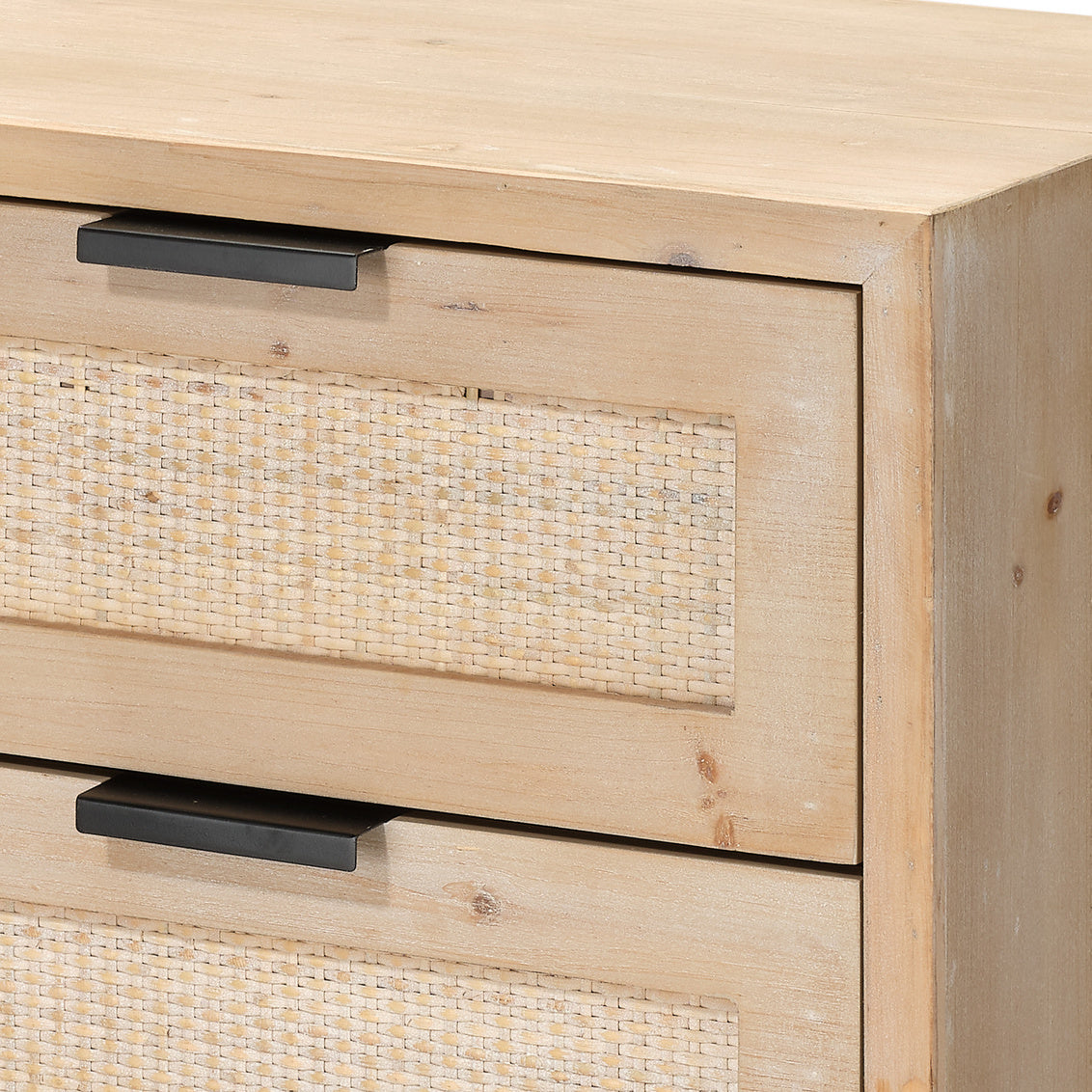Close-up of a wooden drawer with woven texture and black handles.