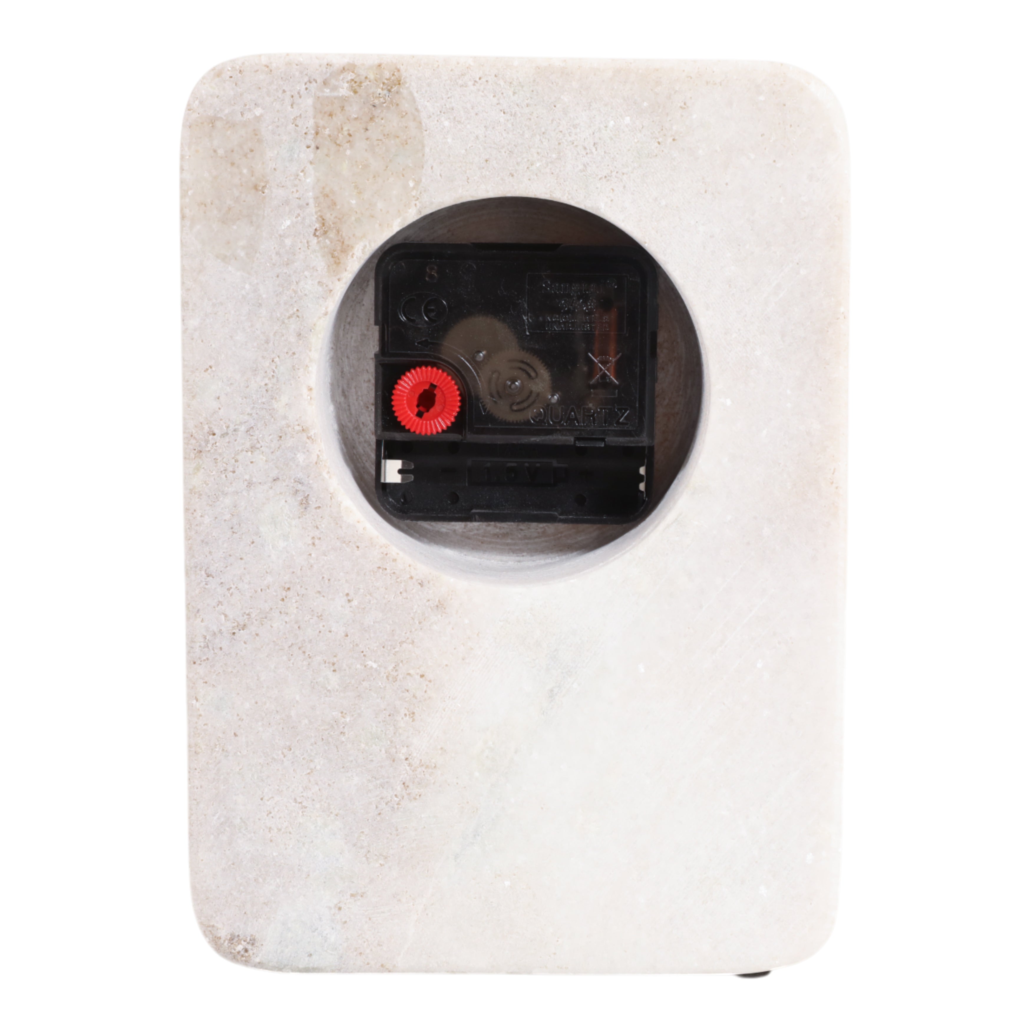 Square white stone object with a black interior component on a white background