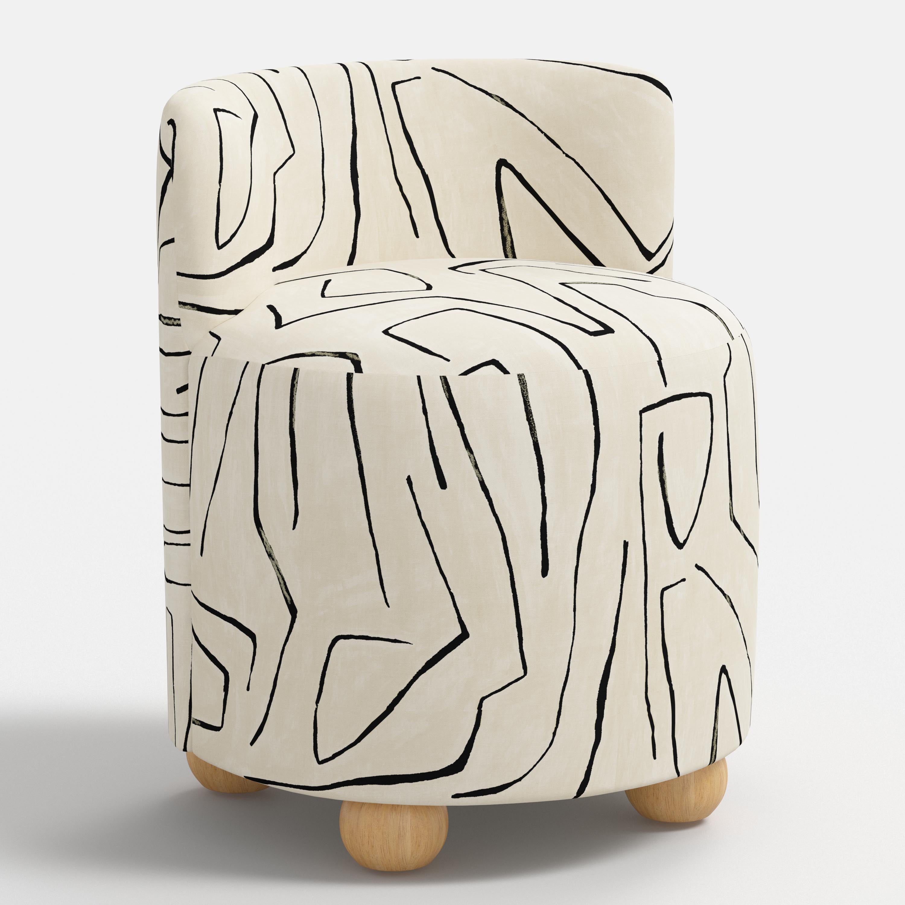 White chair with abstract black line design on a white background