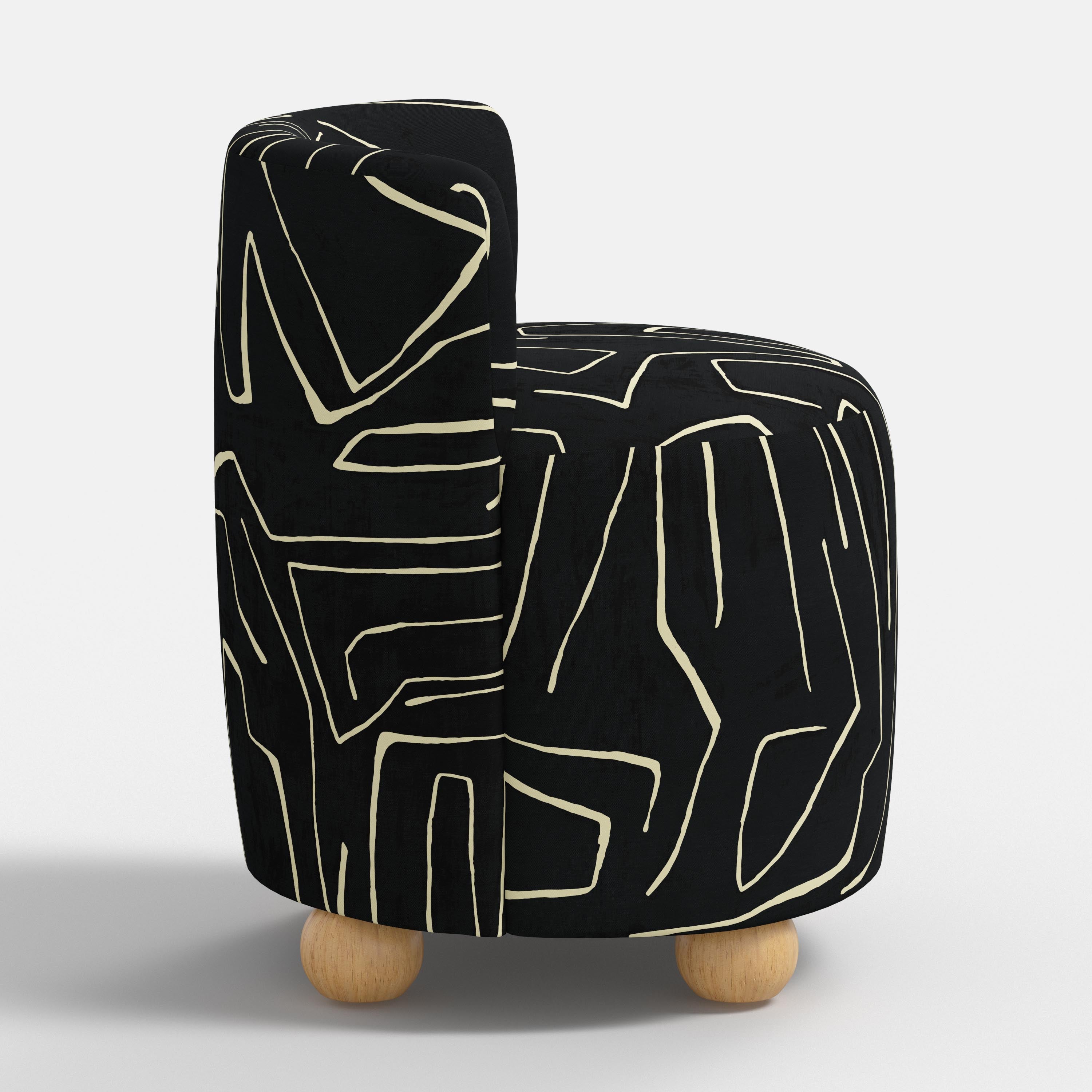 Black and white patterned seat with wooden legs on a white background