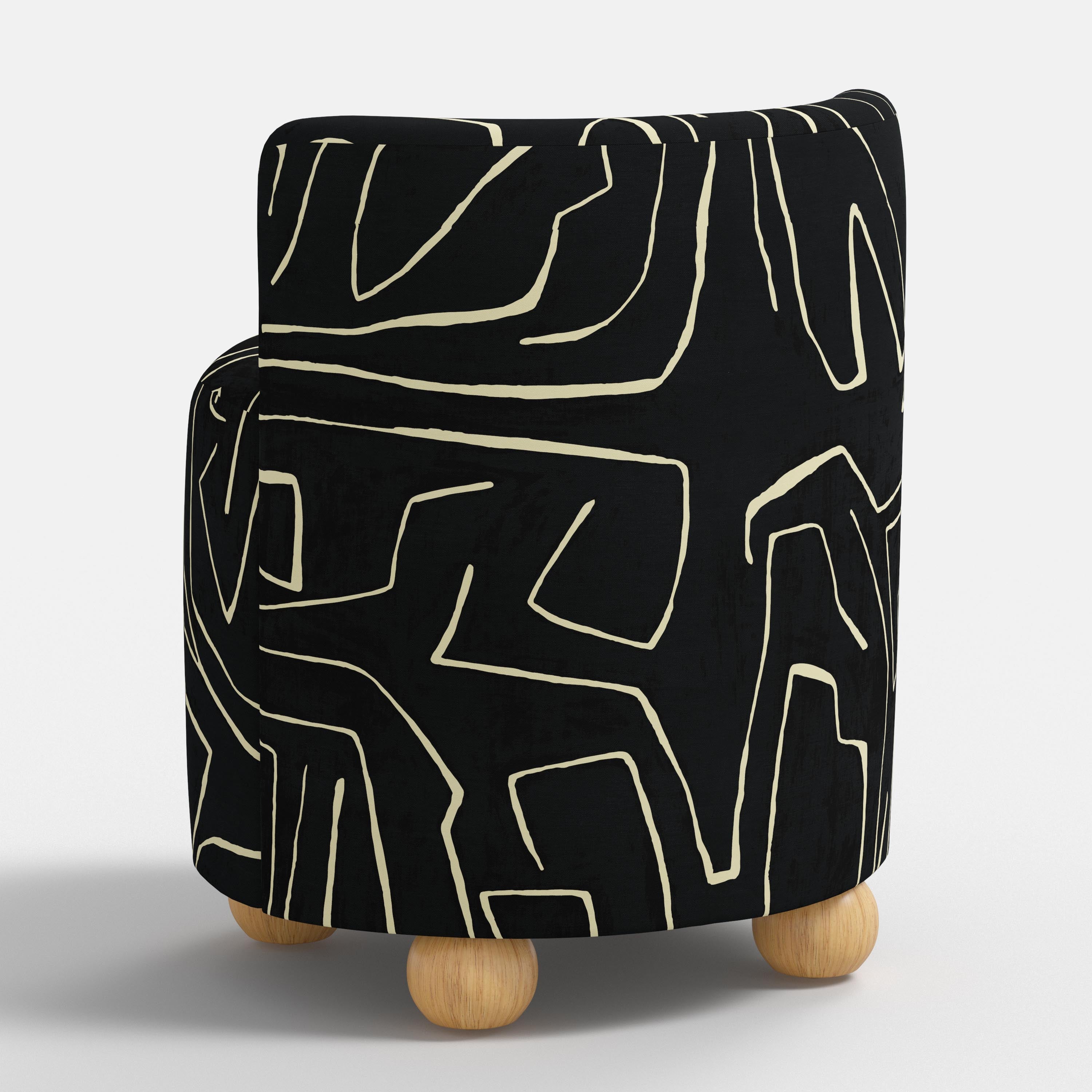 Black and white patterned seat with wooden legs on a white background