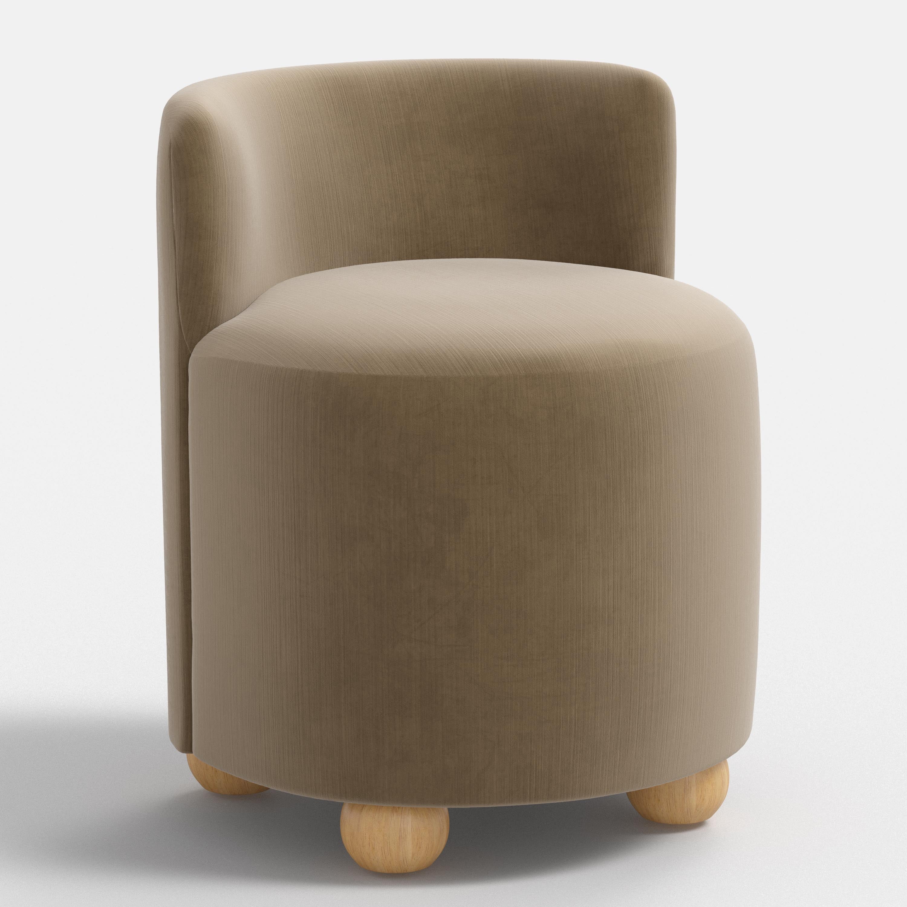 Round brown upholstered chair with wooden legs on a white background