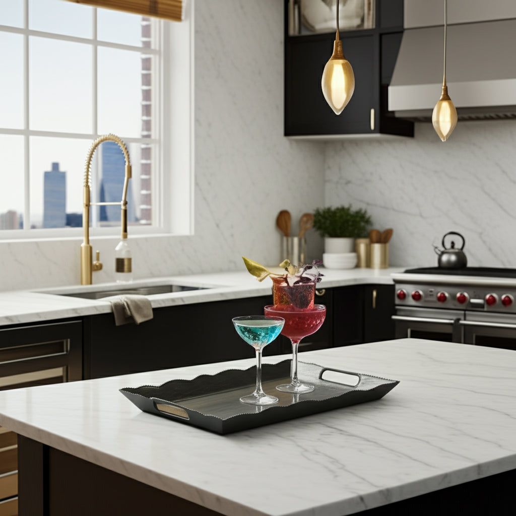 Modern kitchen with a tray of cocktails on a marble island.
