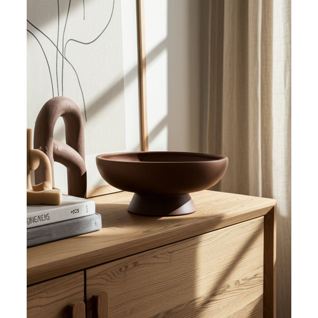 Brown ceramic bowl on a wooden surface with a soft light background