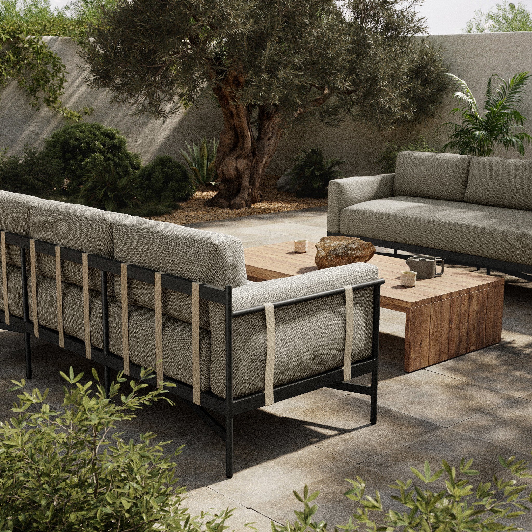 Outdoor patio setting with modern furniture and plants