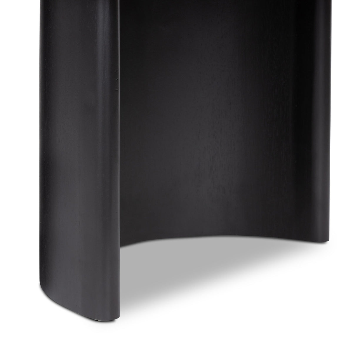 Black cylindrical object on a white background