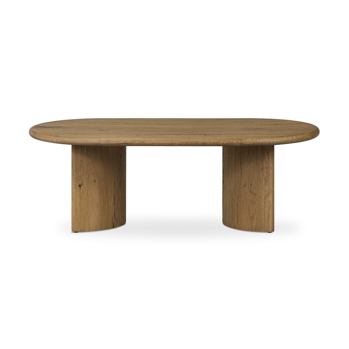 An oval wooden coffee table with a natural oak finish, featuring two thick cylindrical block legs, shown against a plain white background.