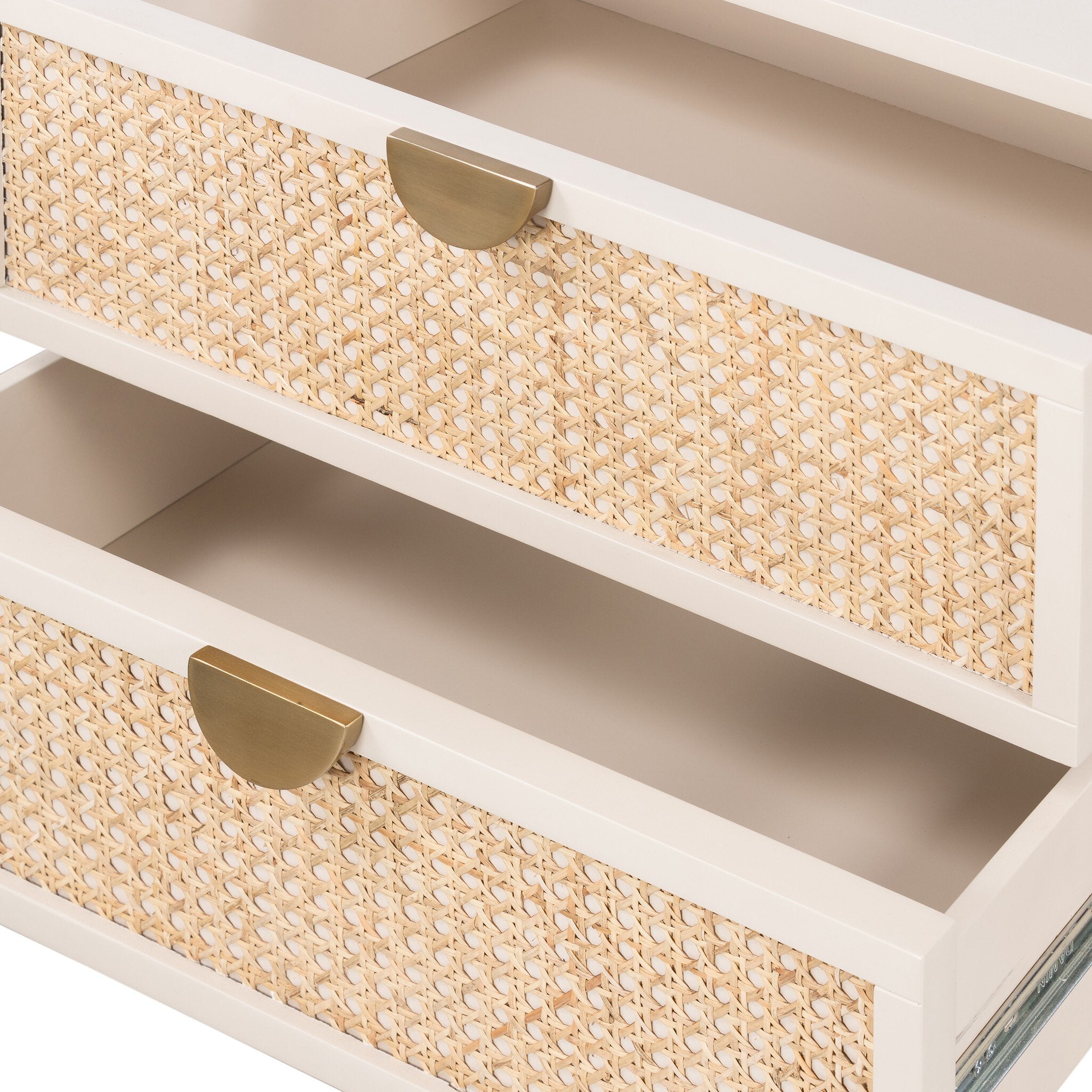 Close-up of a box with woven top and white base, featuring gold handles.