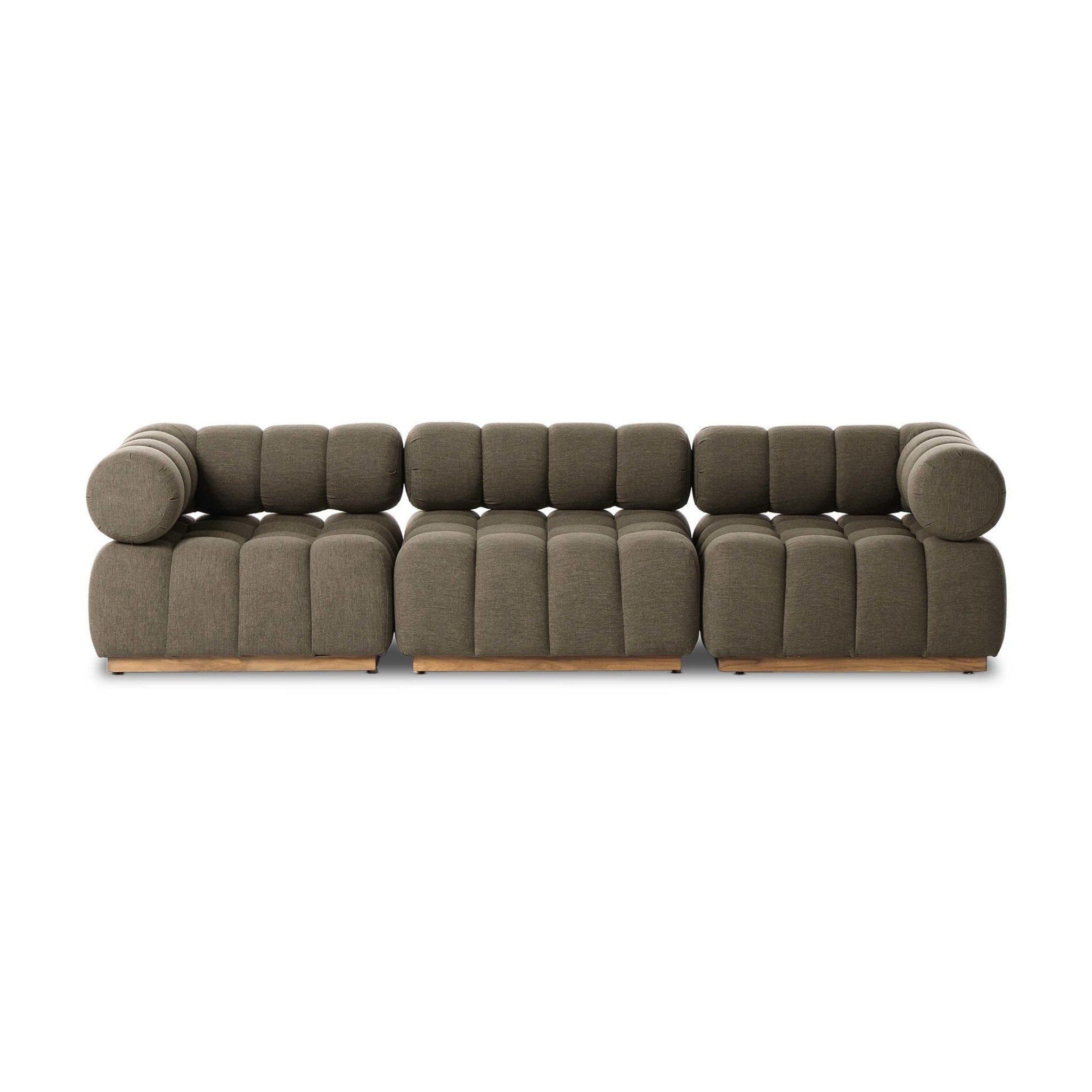 Outdoor three-piece sectional with sculptural elements in a light gray brown finish 