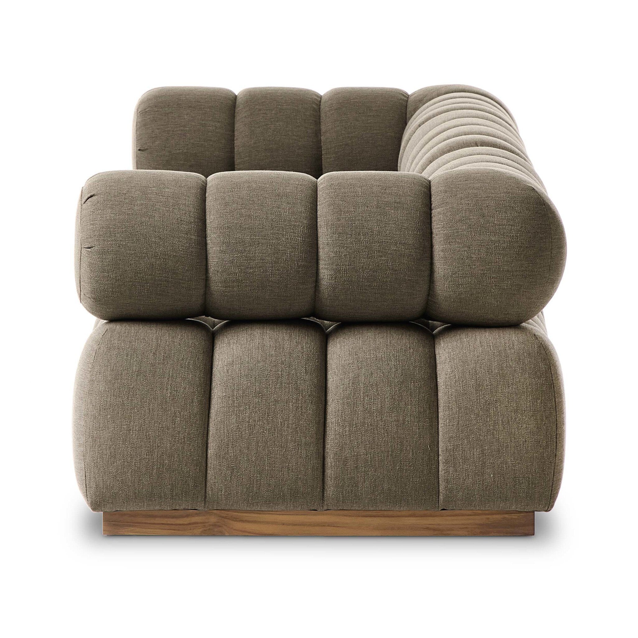 Brown outdoor textured sofa with wooden base on a white background