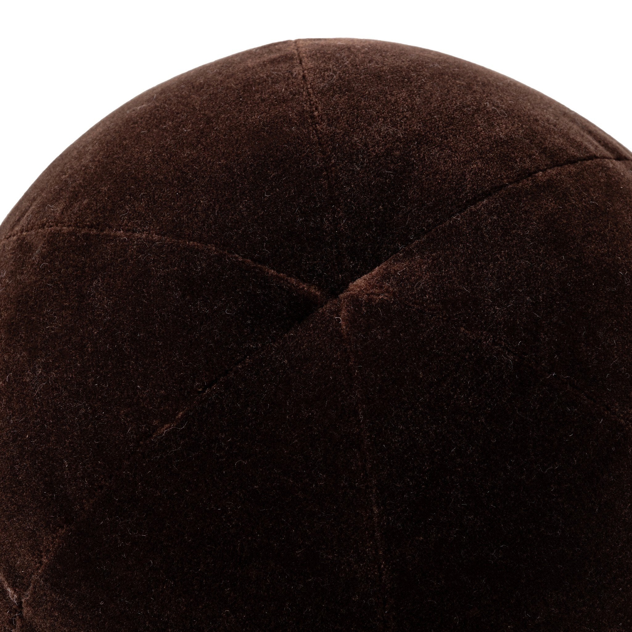 Close-up of a brown velvet pillow with visible texture