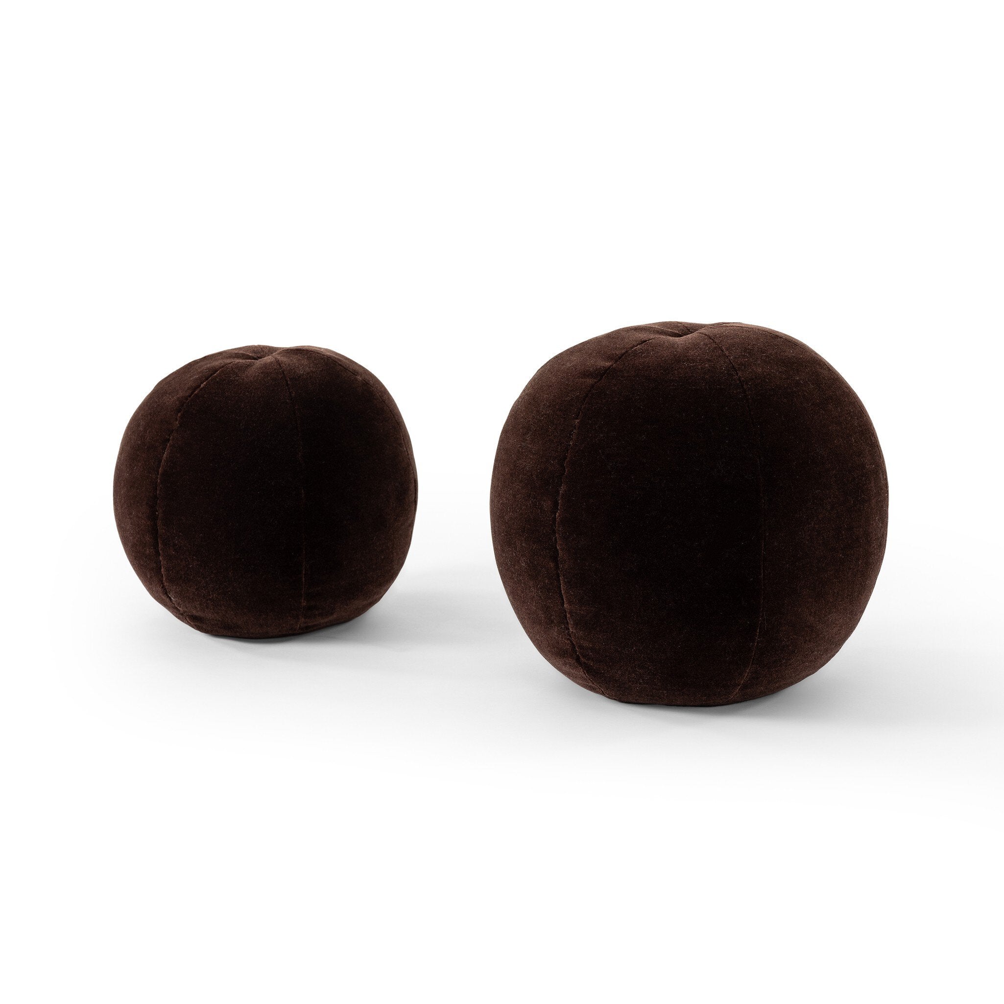 Two brown spherical throw pillows on a white background