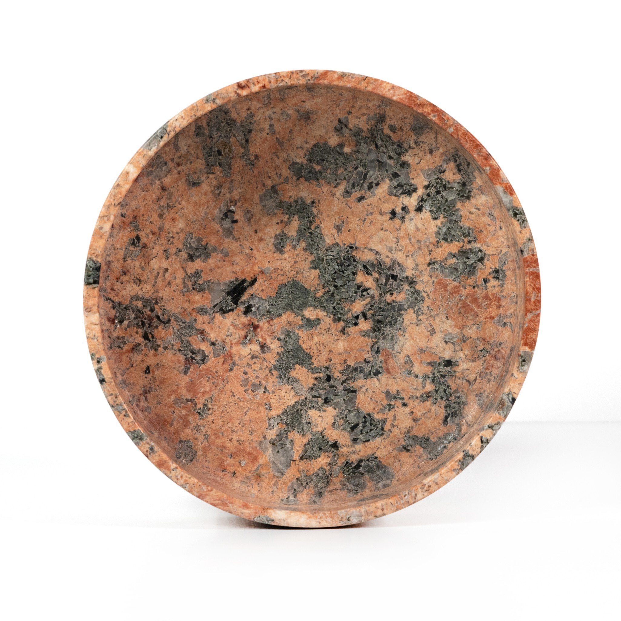 Ceramic bowl with a speckled pattern on a white background