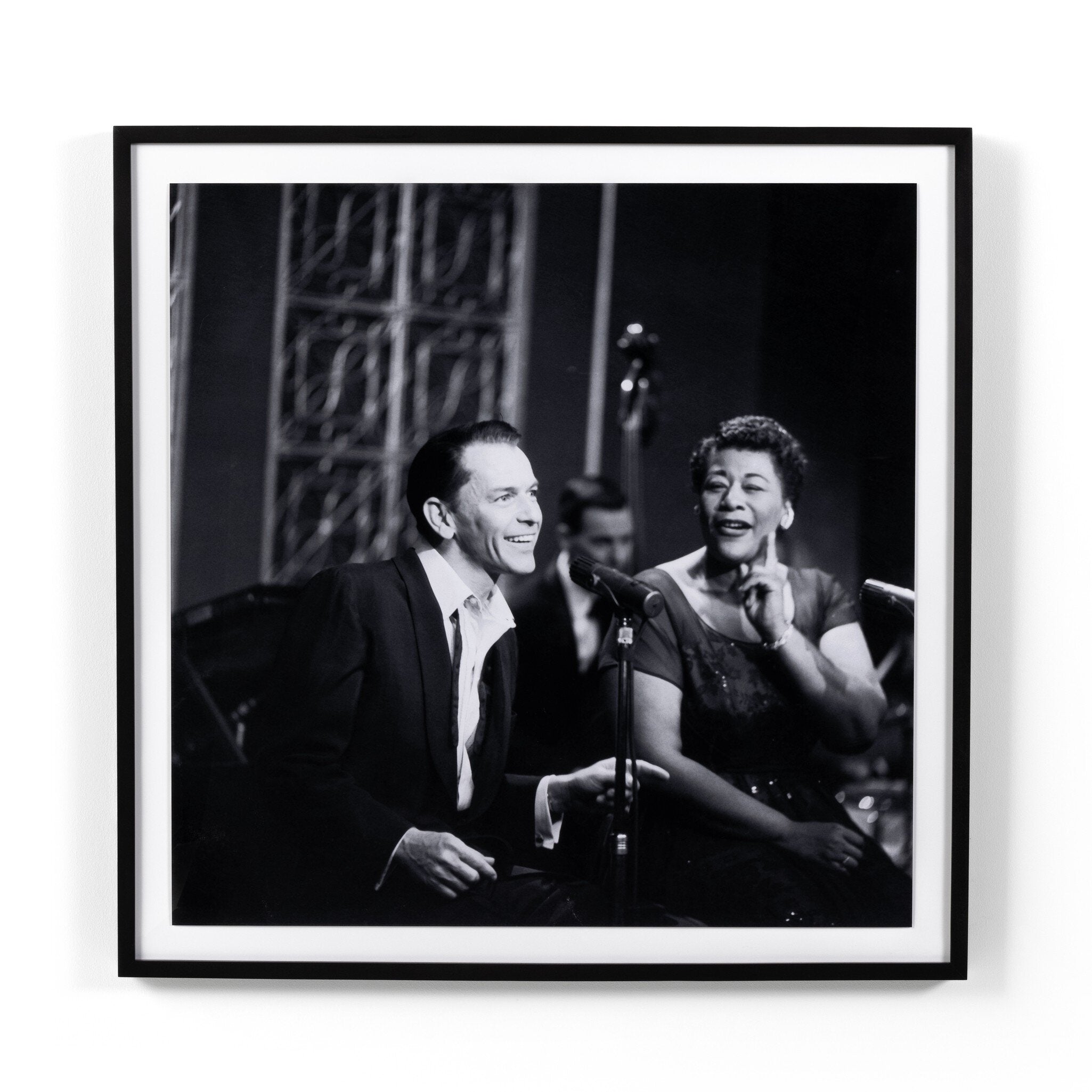 Black and white photograph of a Sinatra & Fitzgerald sitting together, framed in black.