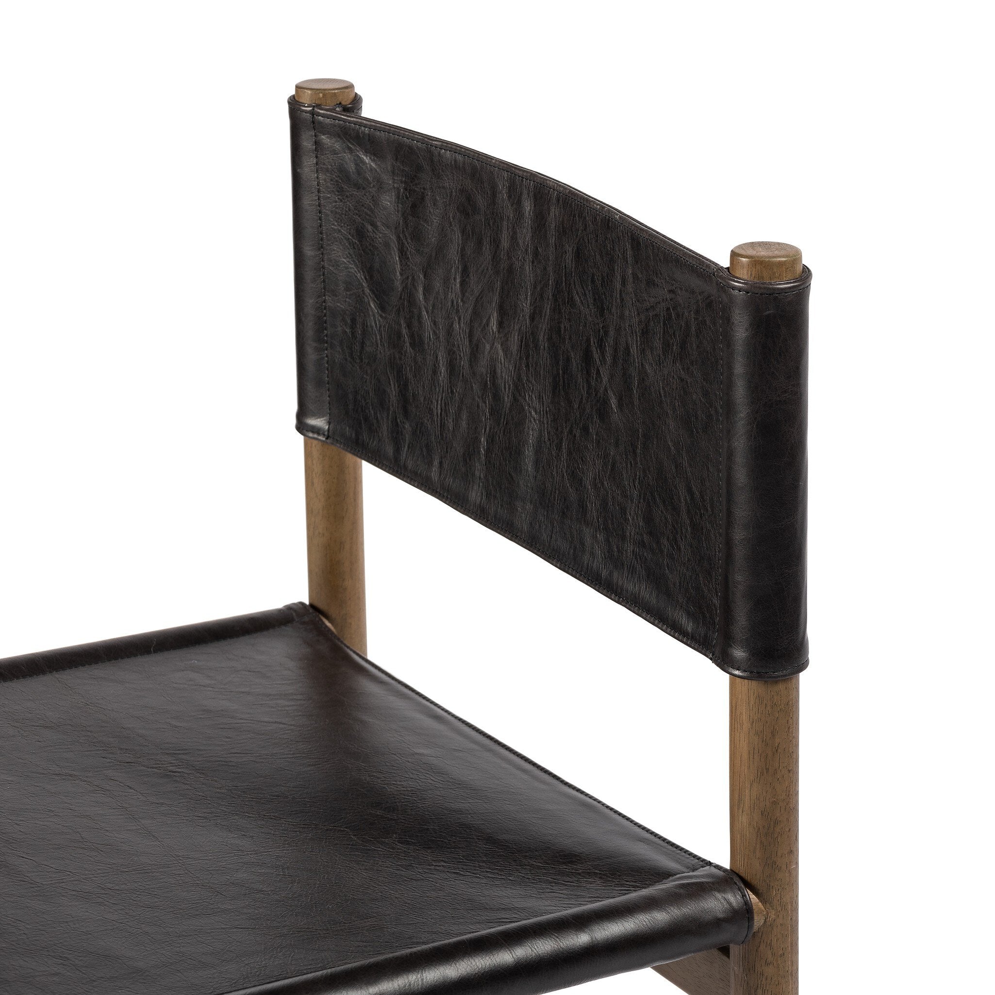 Black leather chair with wooden frame on a white background
